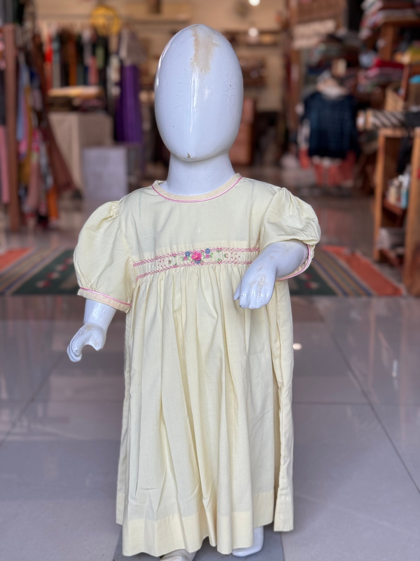 Light yellow hand embroidered smocking frock for girls