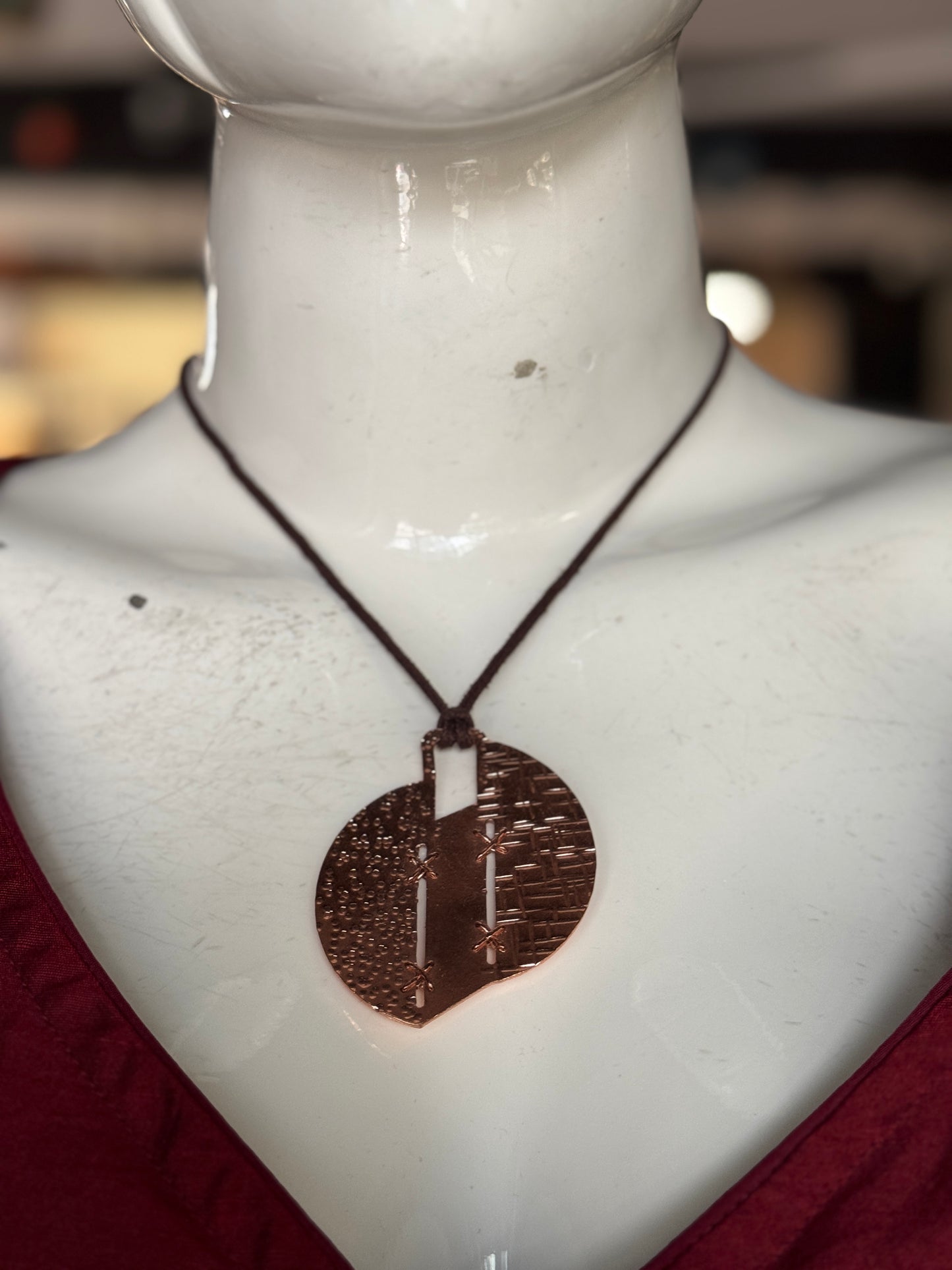 Handcrafted copper pendant with brown thread neck piece