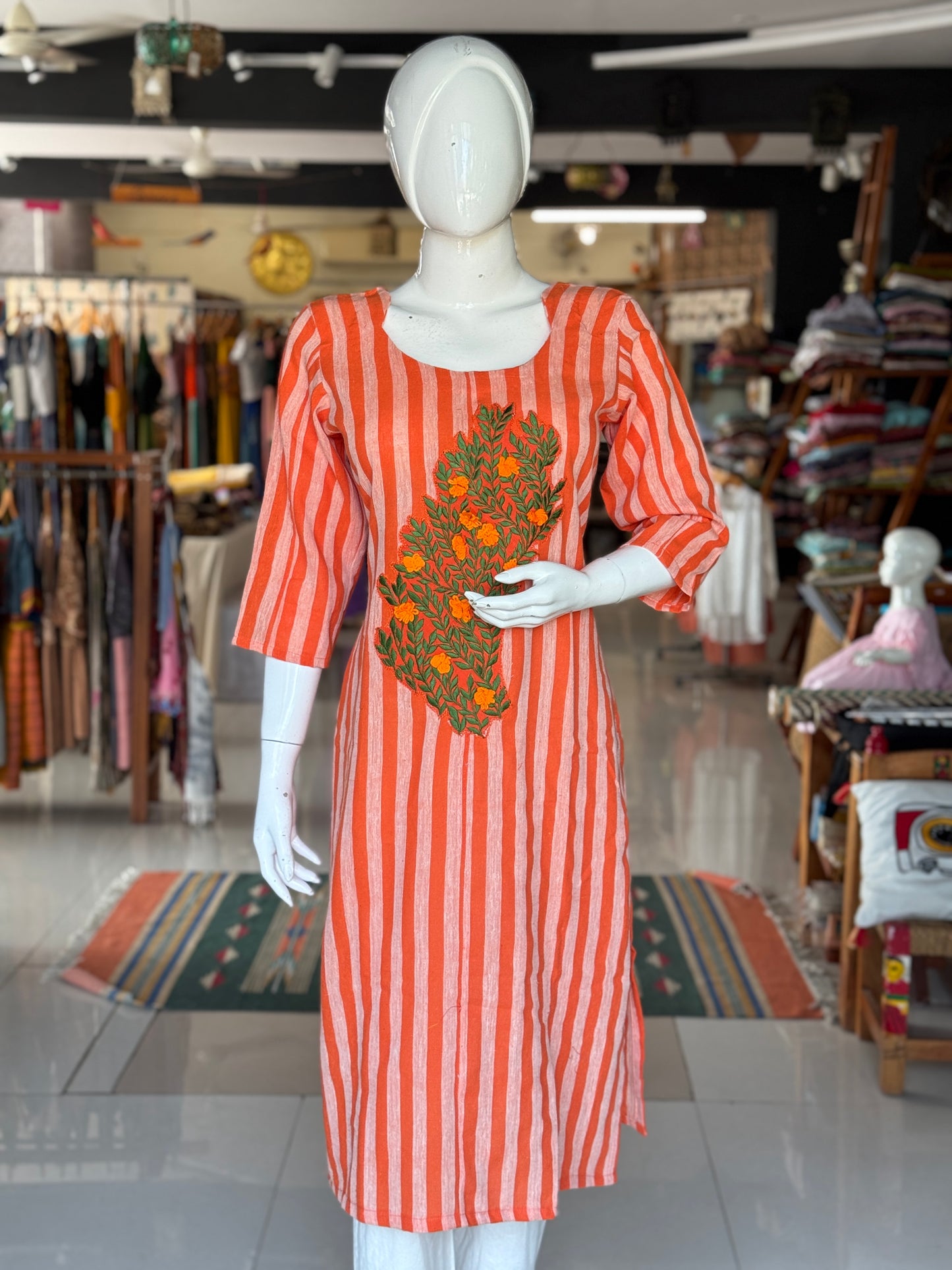 Bright orange stripes handwoven kala cotton straight kurti with leaves and flowers embroidery on the front