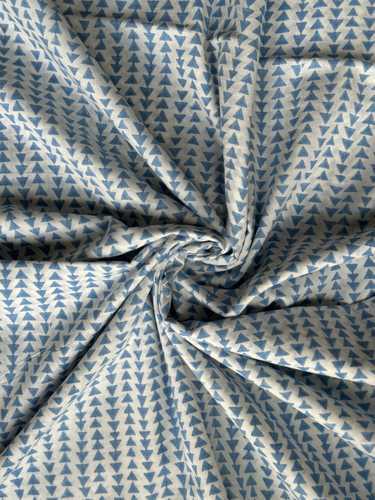 White hand block printed soft cotton fabric with small blue triangles