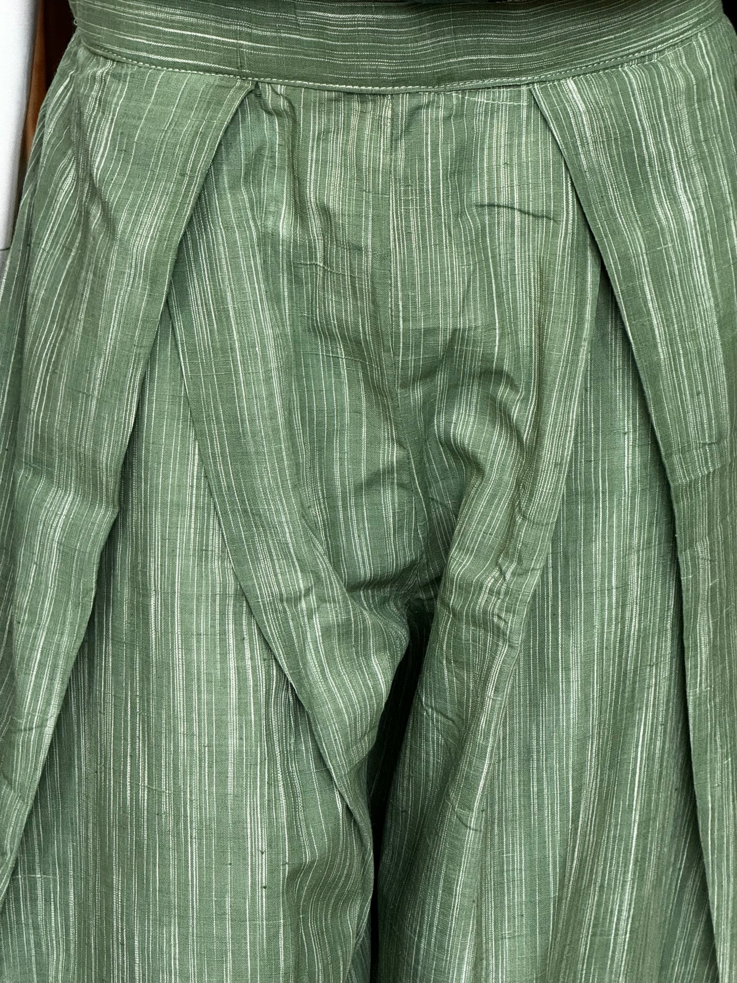 Green handloom cotton flared pants with pleats at waist detailing