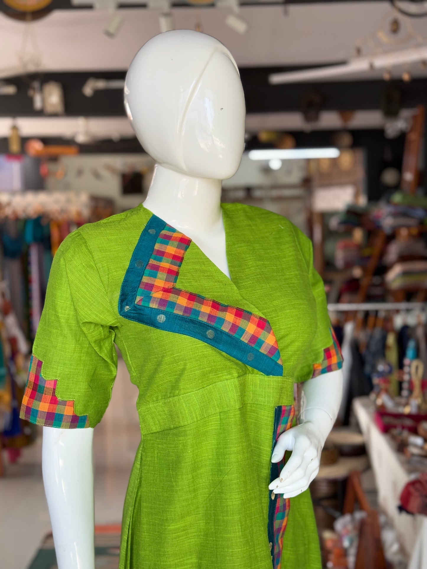 Green cotton dress with colorful madras checks and turquoise borders