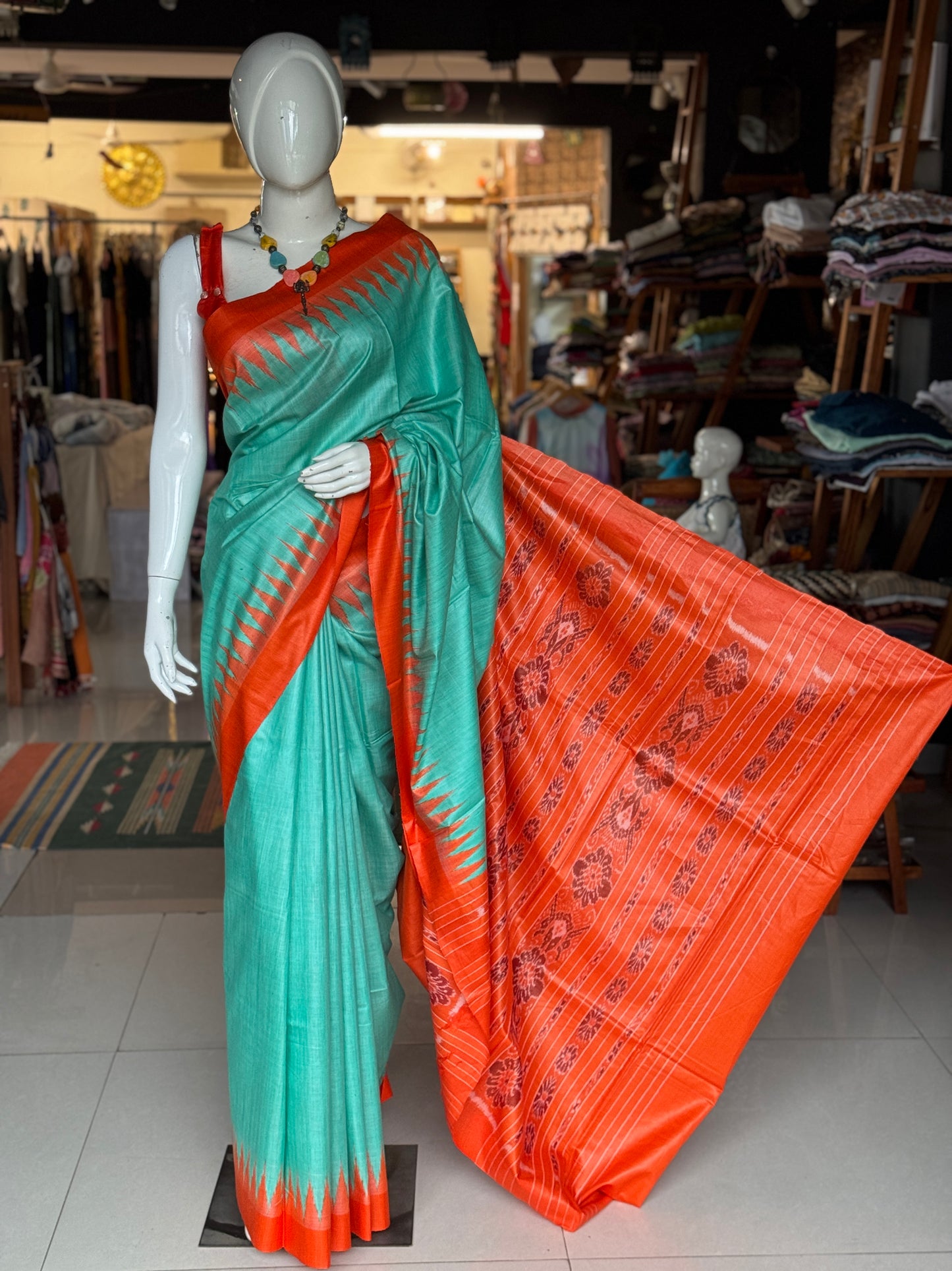 Sea green and orange tussar handwoven saree with ikat palla