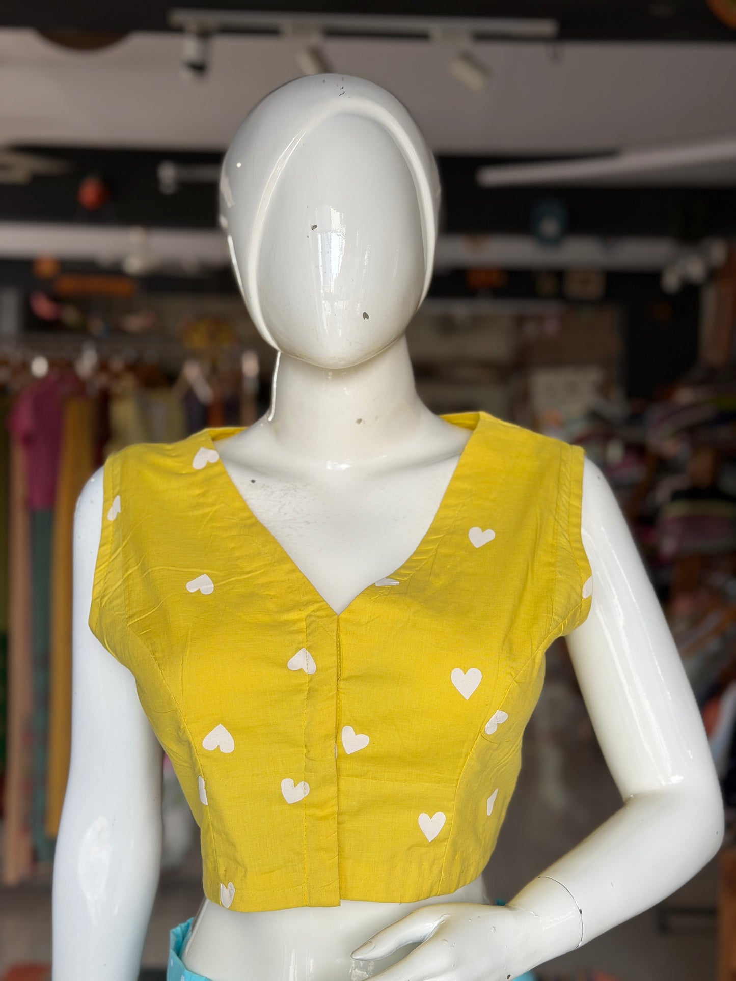 Yellow hearts print sleeveless cotton front open blouse