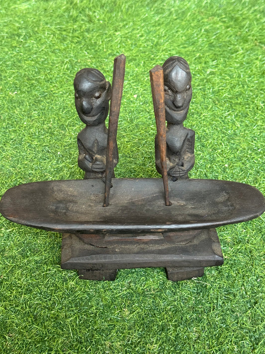 2 people pounding rice - traditional wooden sculpture from Nagaland