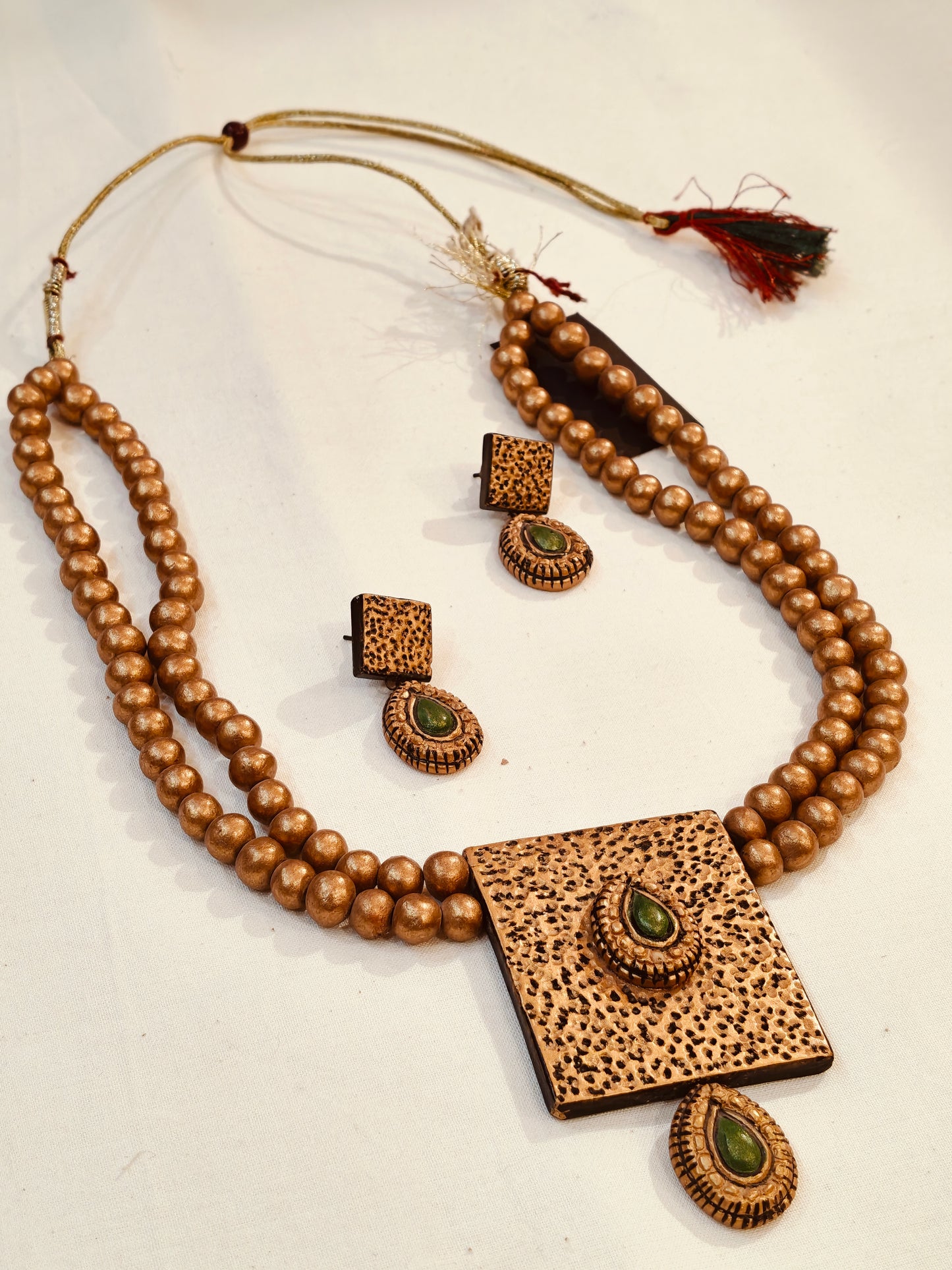 2 layered golden terracotta beads with green accents neckpiece, earrings set