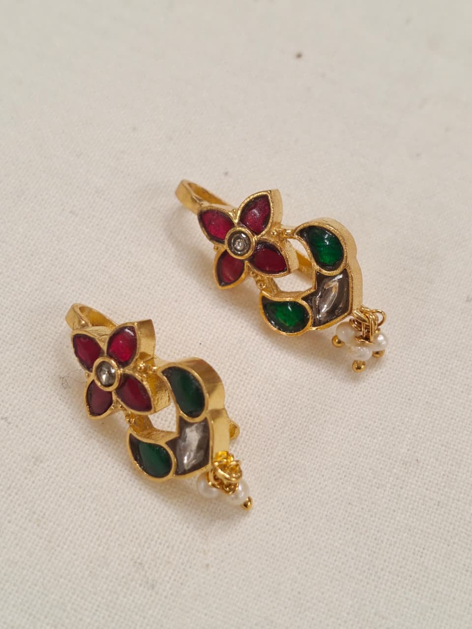 Four petal flower shaped silver ear clip ons in Pink and green stones