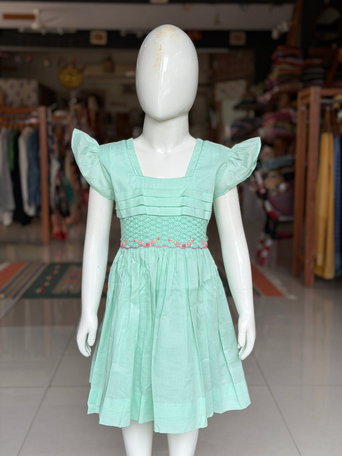 Mint green hand embroidered smocking cotton frock for girls with horizontal pintucks