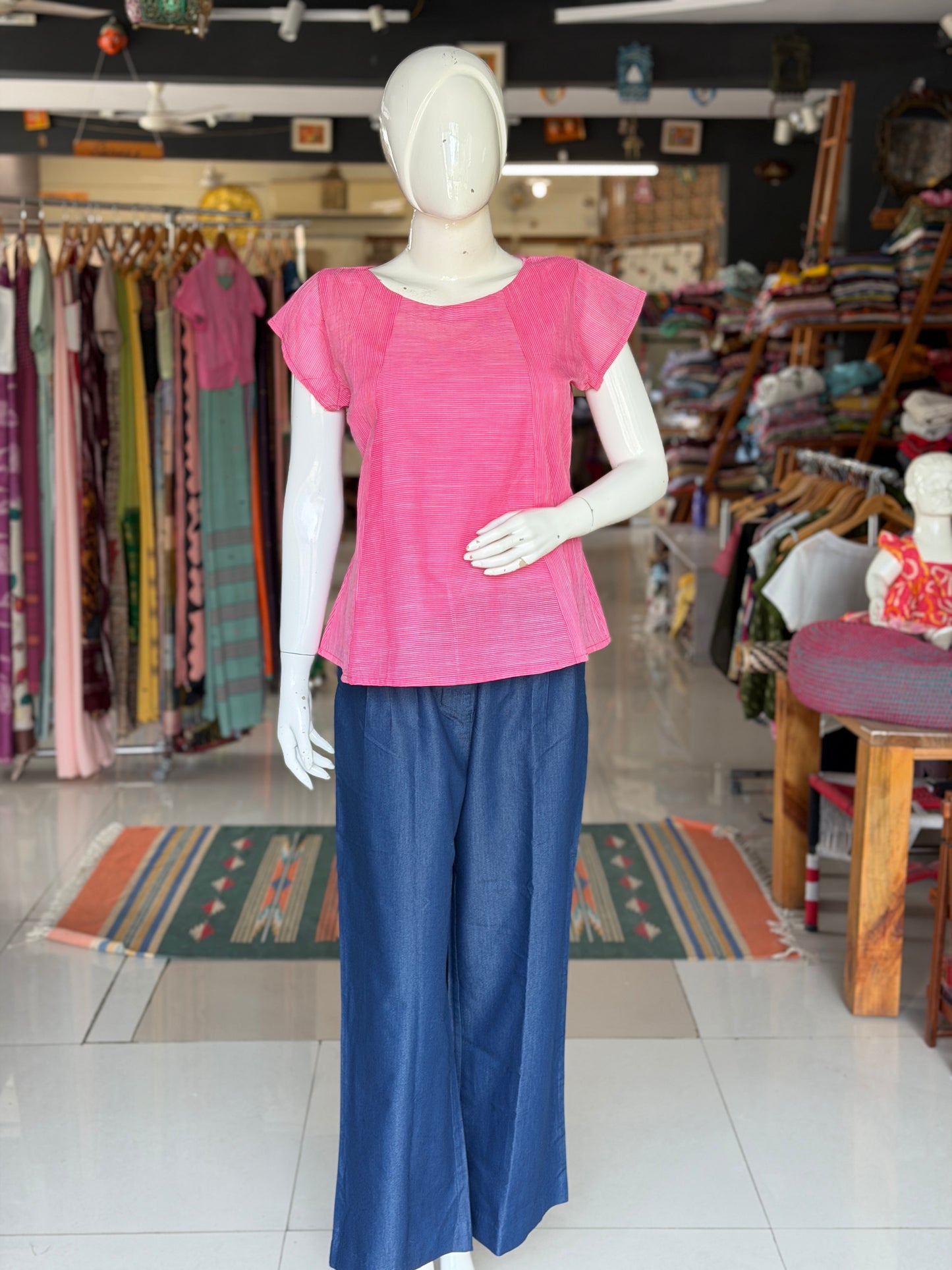 Blue cotton denim pleated pants with buttons detailing