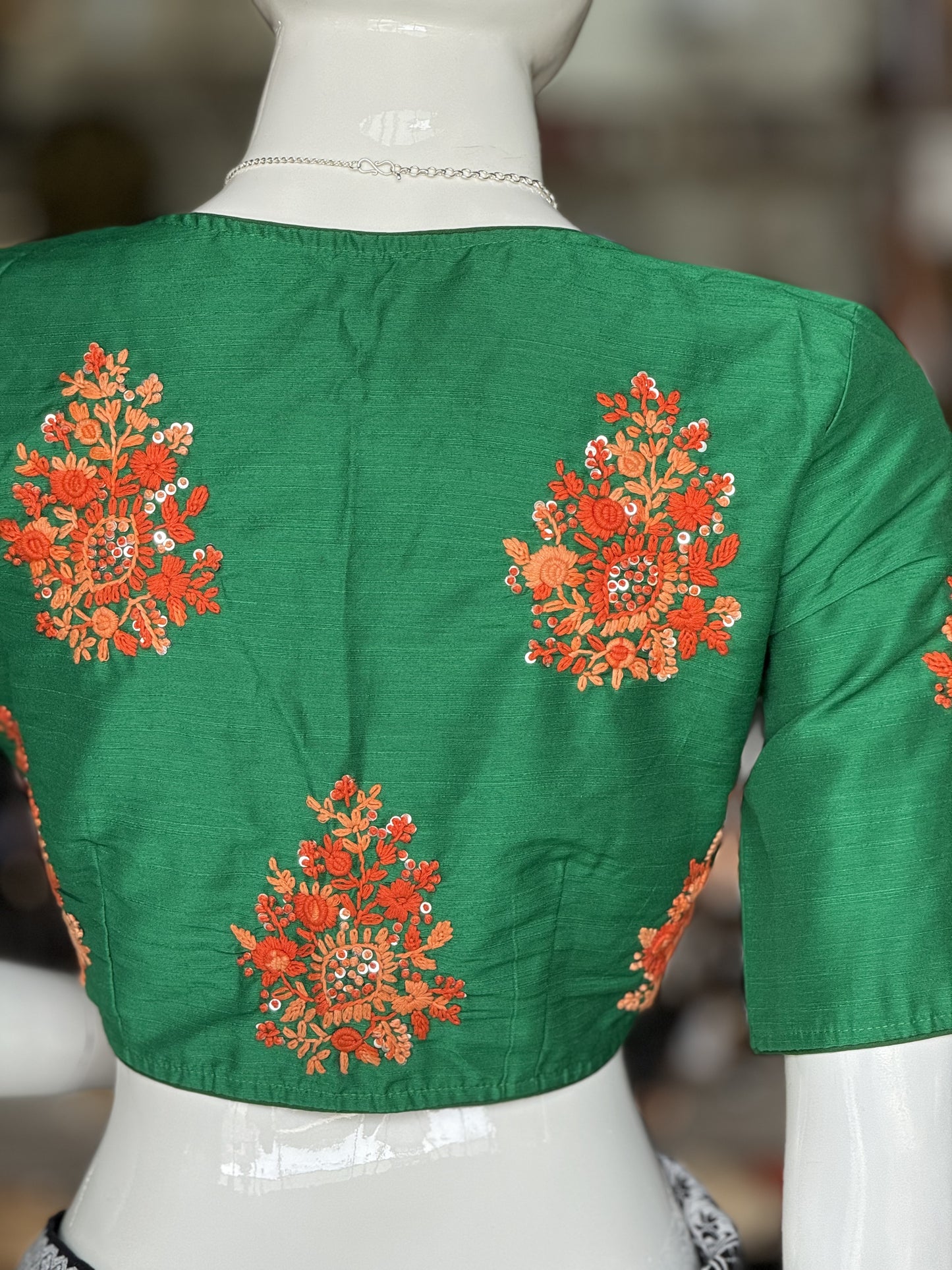 Green silk blouse with hand embroidered flowers