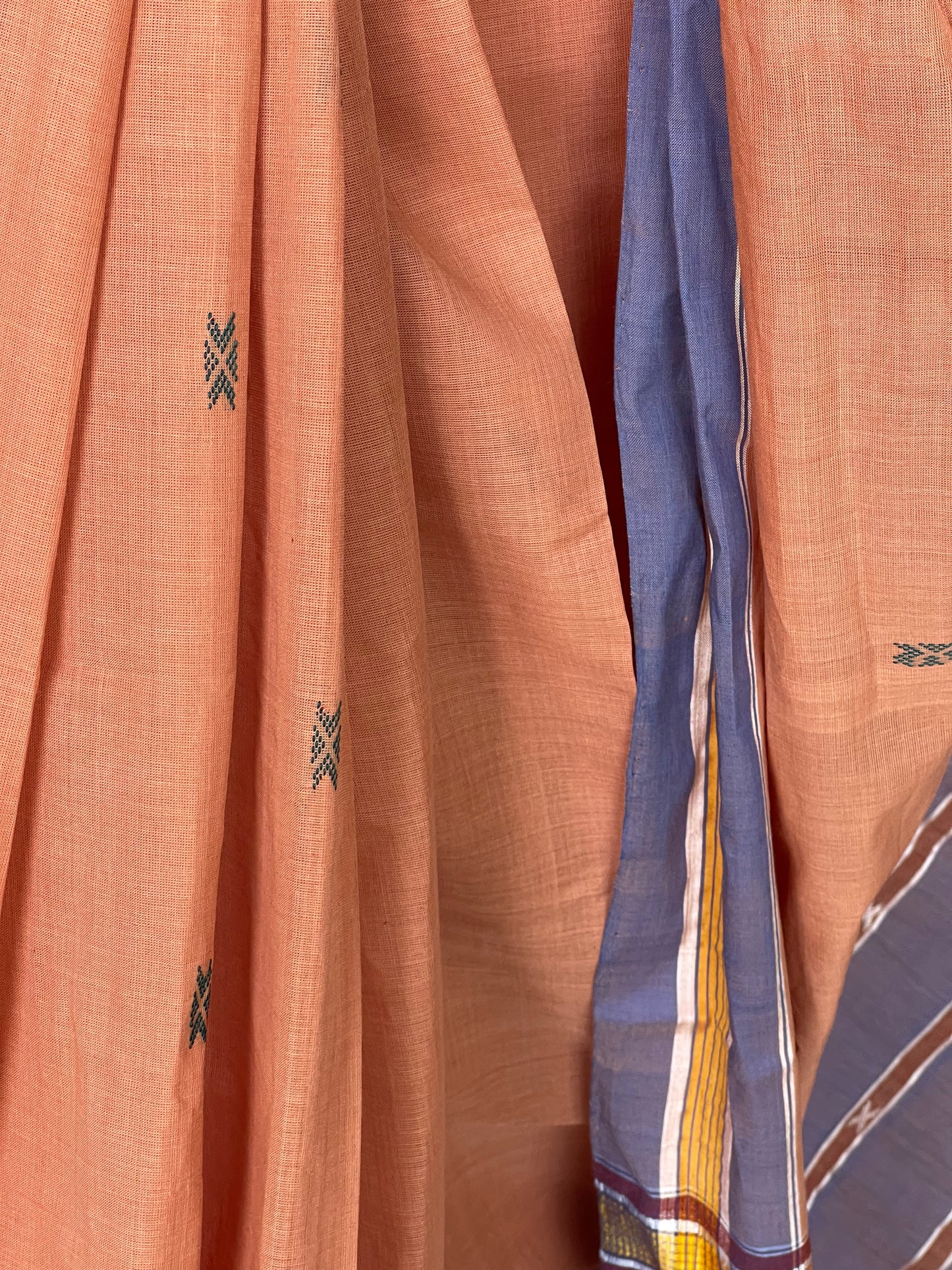 Peach handwoven cotton saree with butis all over and stripes palla