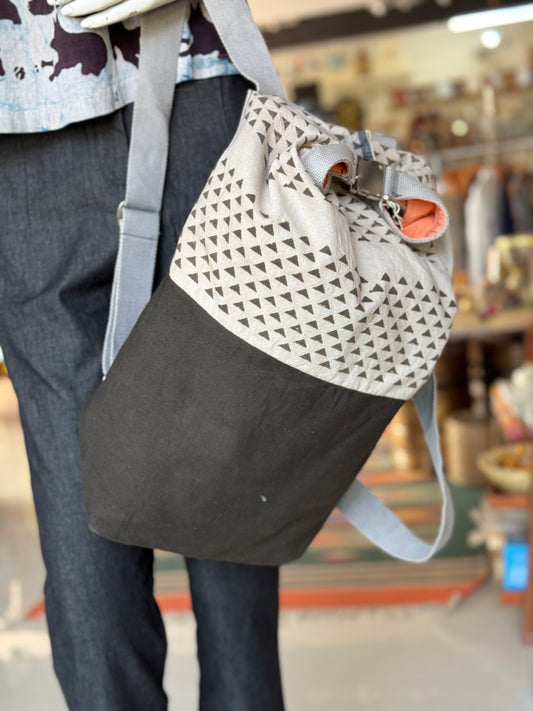 Natural dyed, organic cotton back pack - adjustable bag size with metal clasp at the top, safe pocket at the back