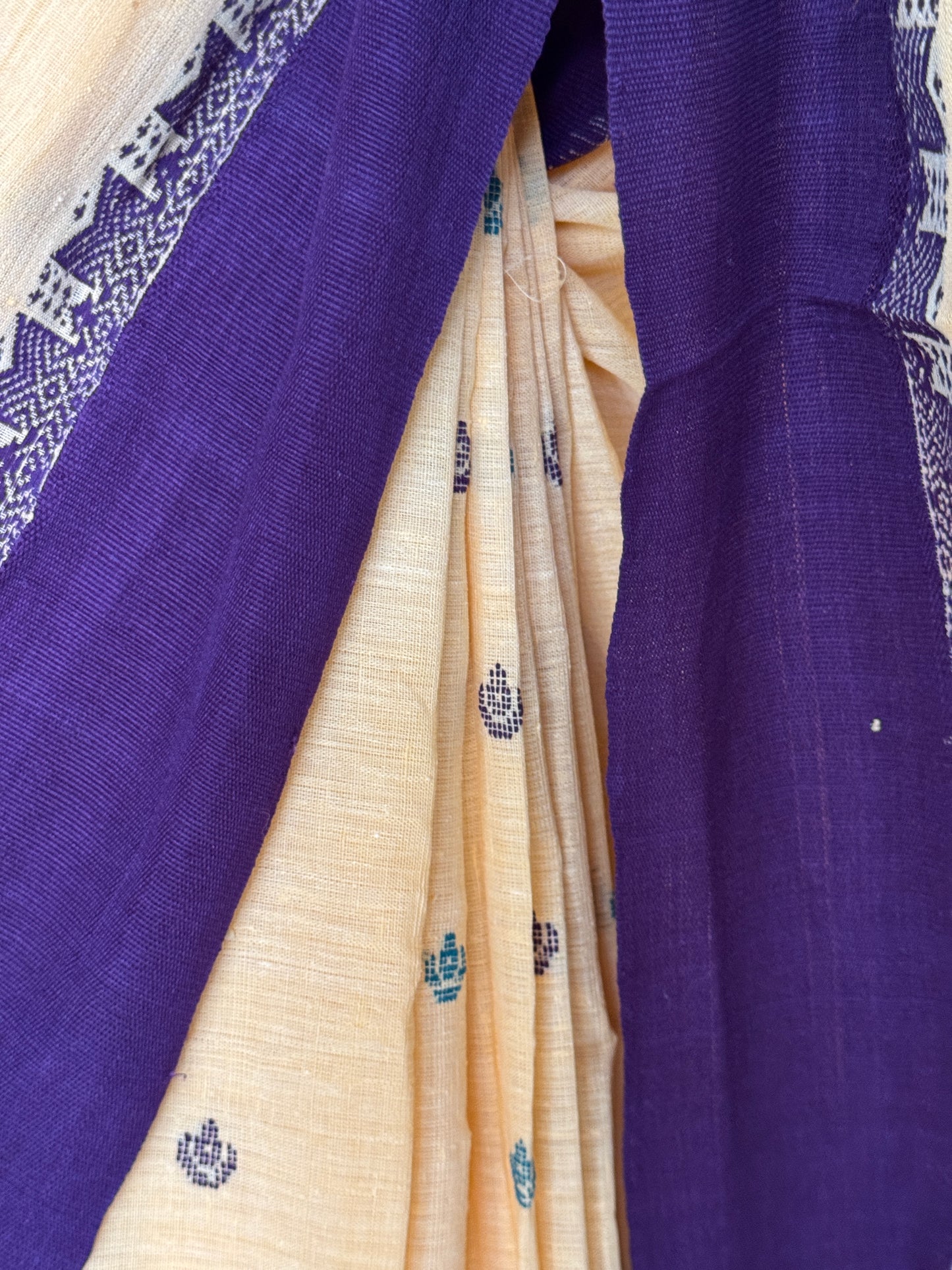Yellow coarse textured handloom cotton saree with small butis and purple Kuppadam border