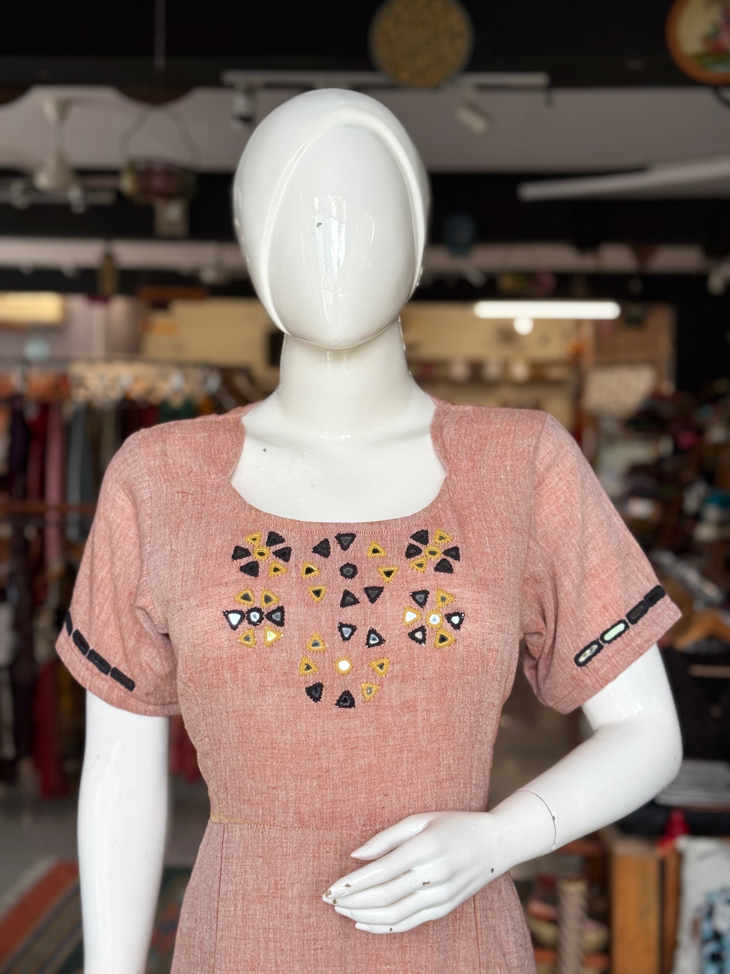 Light peachish maroon kala cotton hand woven pleated dress with mirror embroidery on yoke