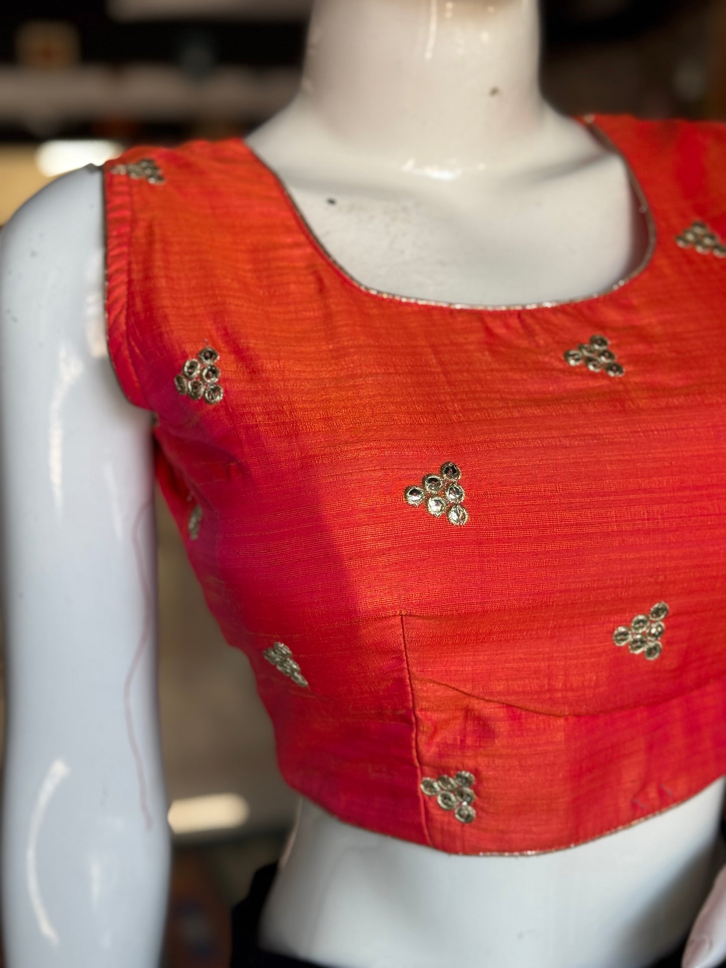 Orange embroidered sleeveless blouse with deep back