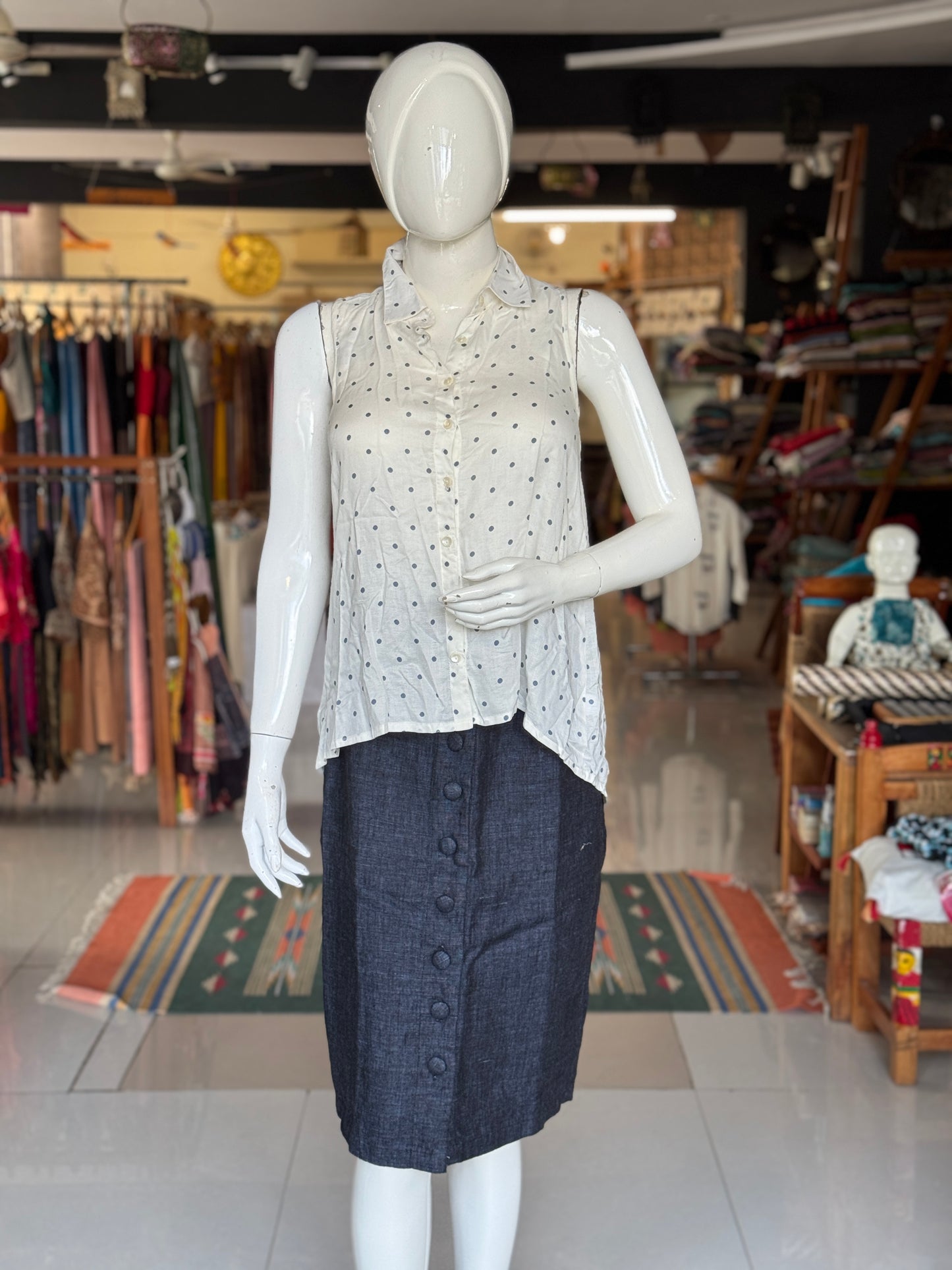 Polka dot prints on white sleeveless top for women