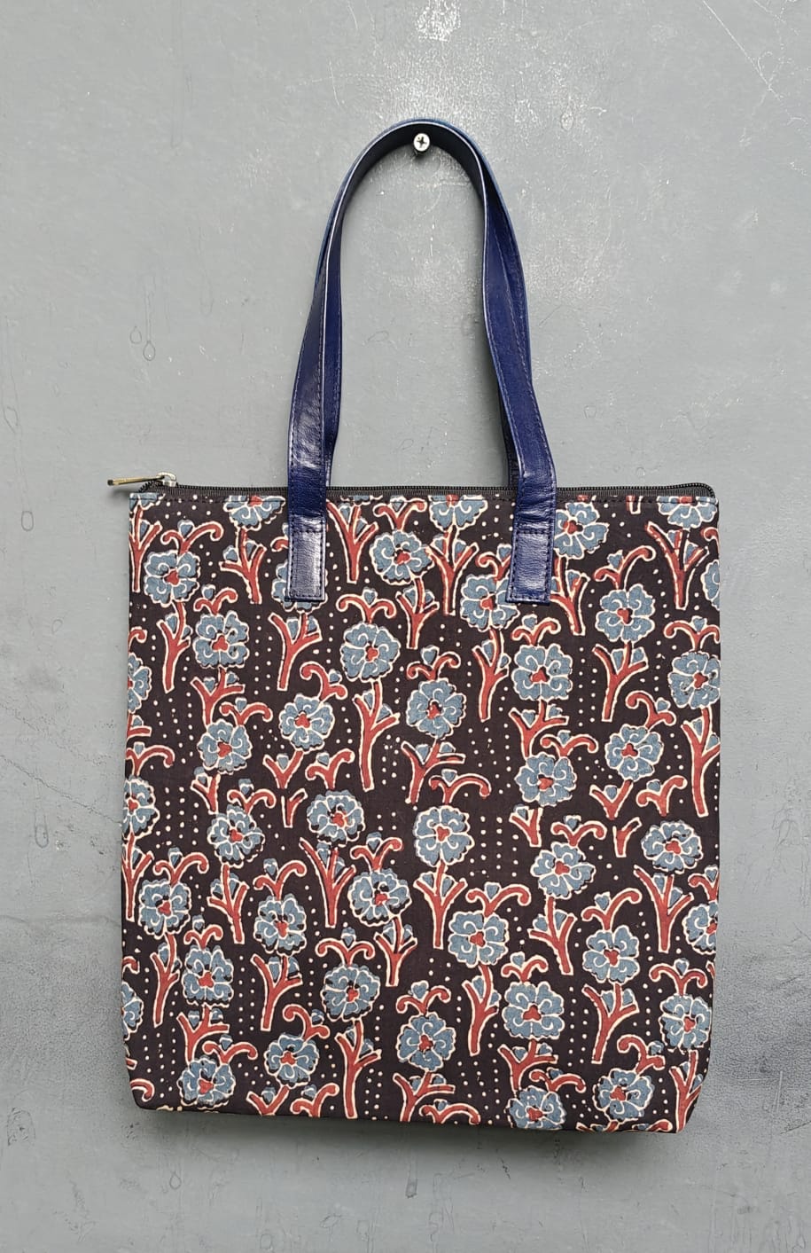 Hand crafted fabric tote bag with leatherflap closure front pocket and leather handles
