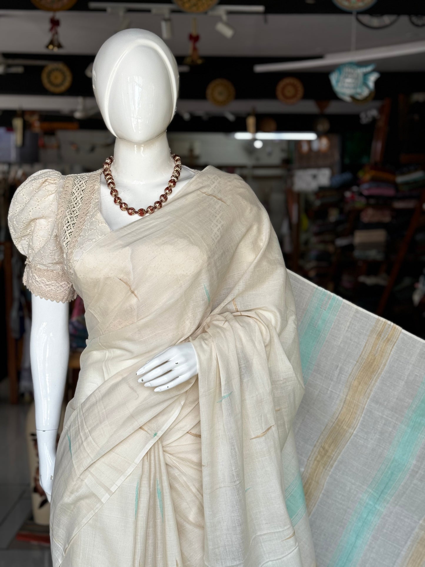 Offwhite pure soft cotton handloom saree with sea green and beige accents