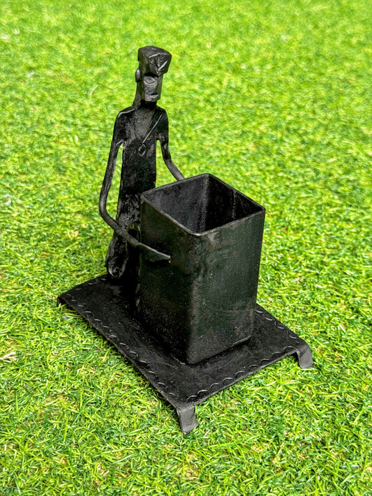 Pen stand - man sitting with basket - handcrafted wrought iron