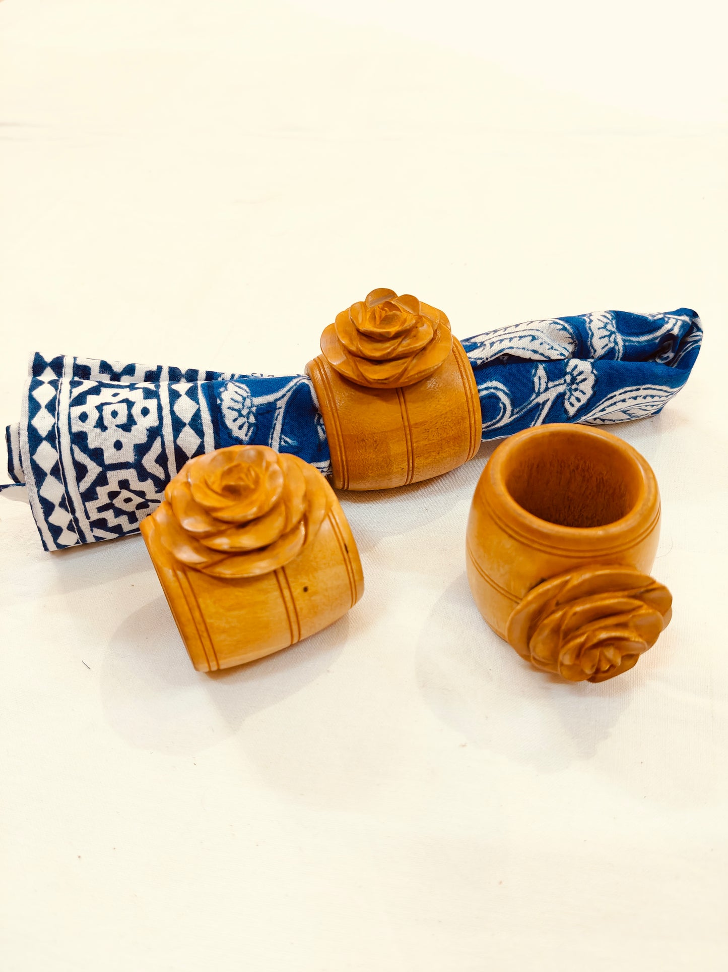 Wooden hand carved napkin ring with a beautiful carved rose on top