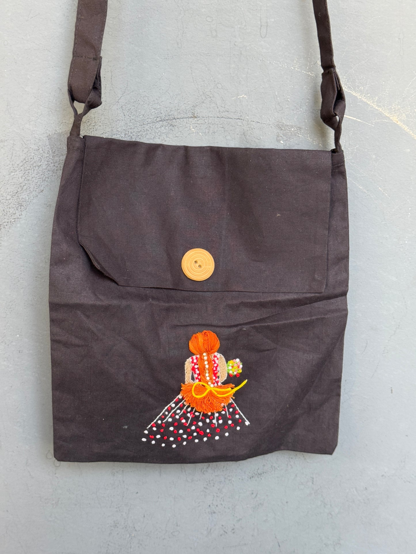 Black fabric sling bag with hand embroidered girl - velcrow closure