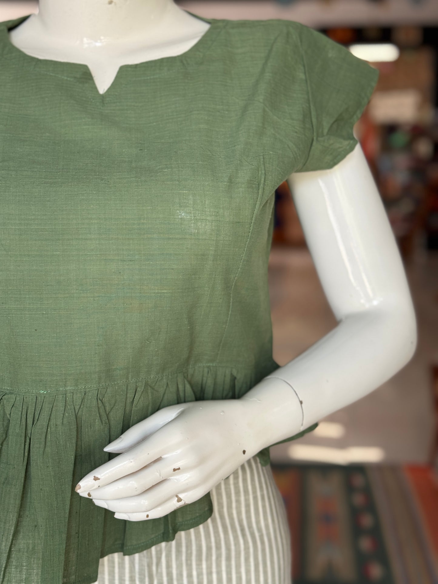 Green cotton handloom top with high low pleated hem