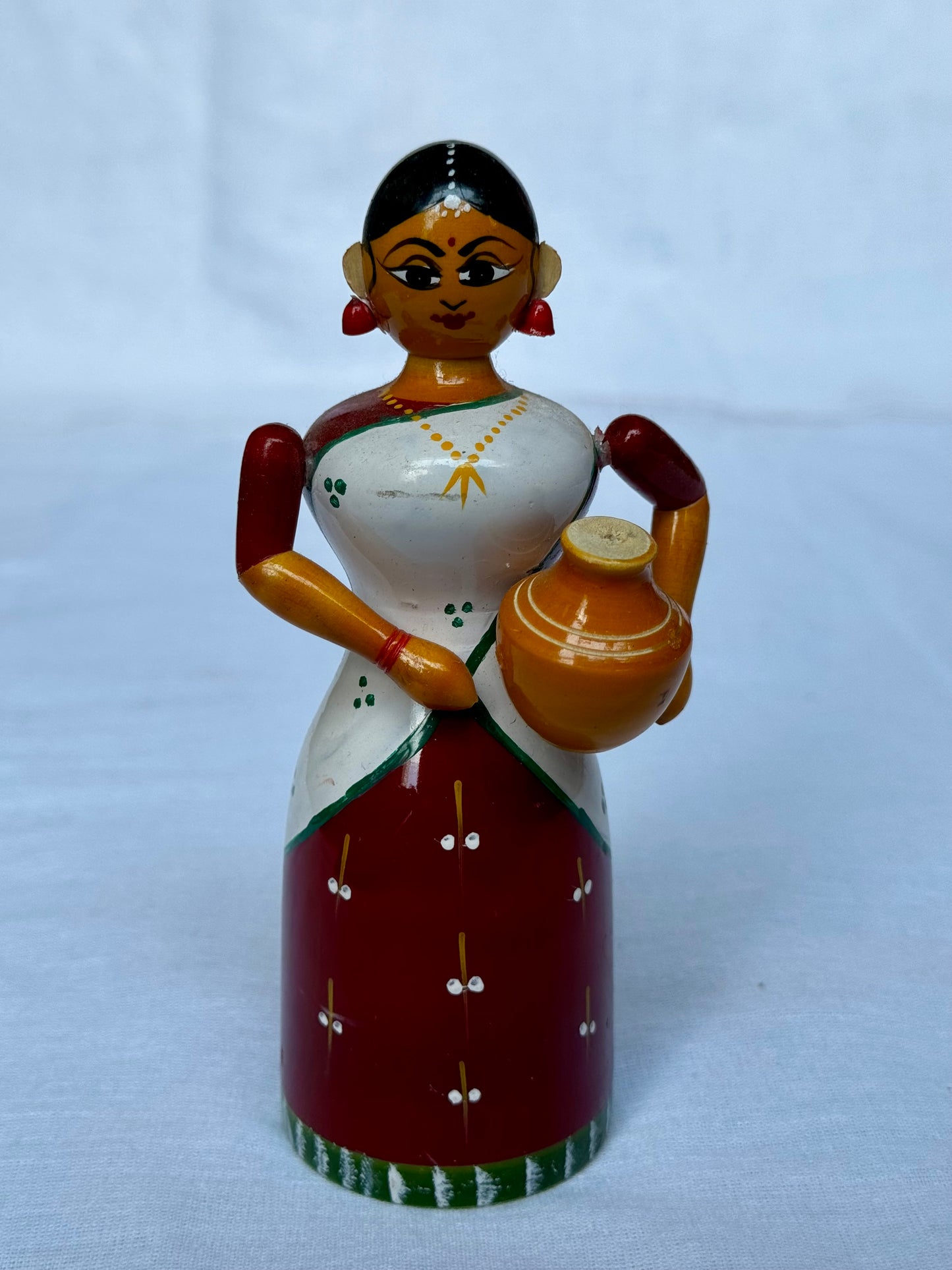 Lady in a half saree carrying pot - Etikoppaka Wooden handicraft decor