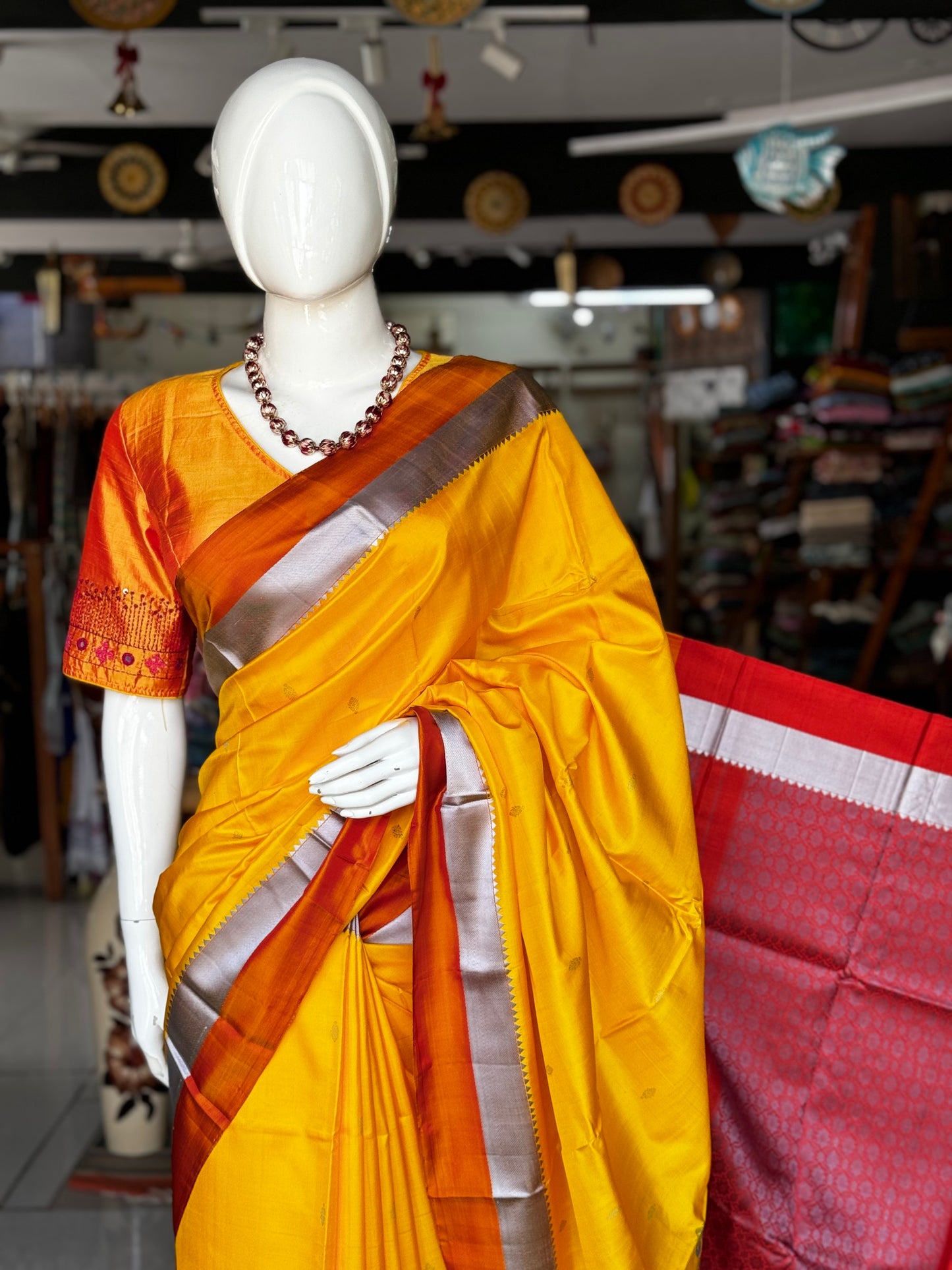 Haldi yellow pure silk Kodiyala handloom saree with all over gold butis and silver katan border