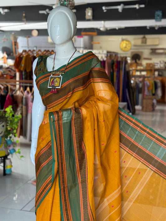 Mustard yellow and green Chettinad cotton handloom saree with butis all over and wide borders