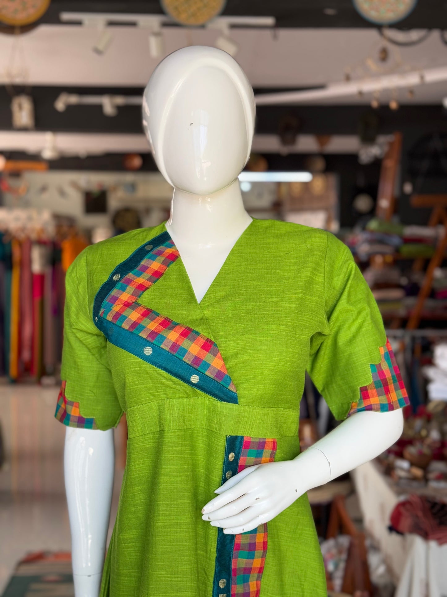 Green cotton dress with colorful madras checks and turquoise borders