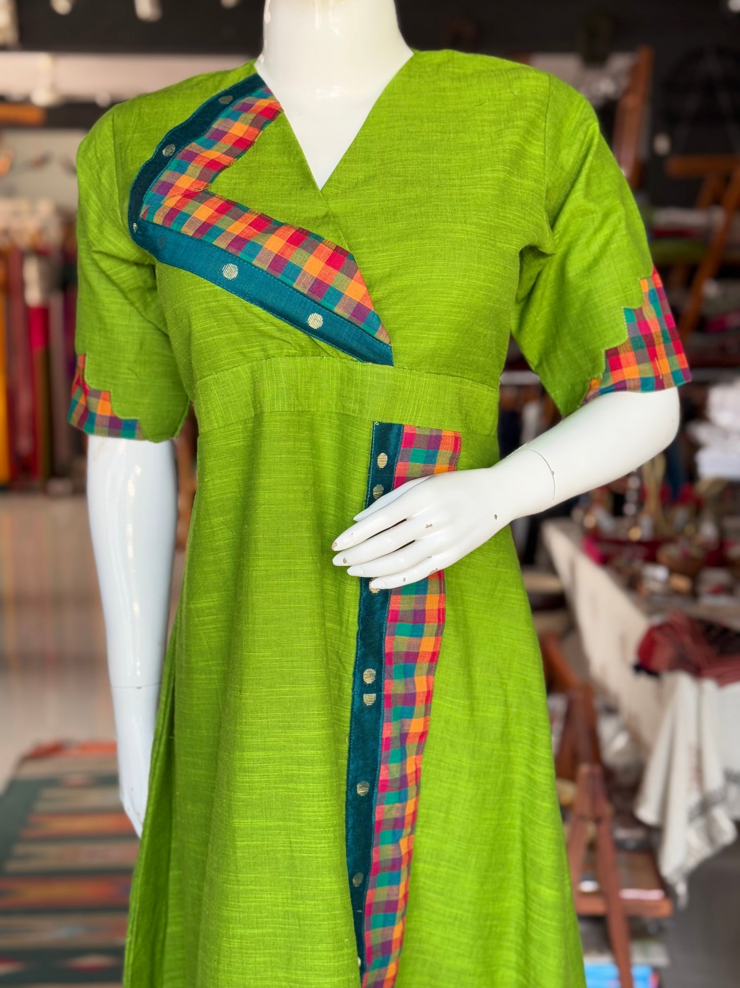 Green cotton dress with colorful madras checks and turquoise borders
