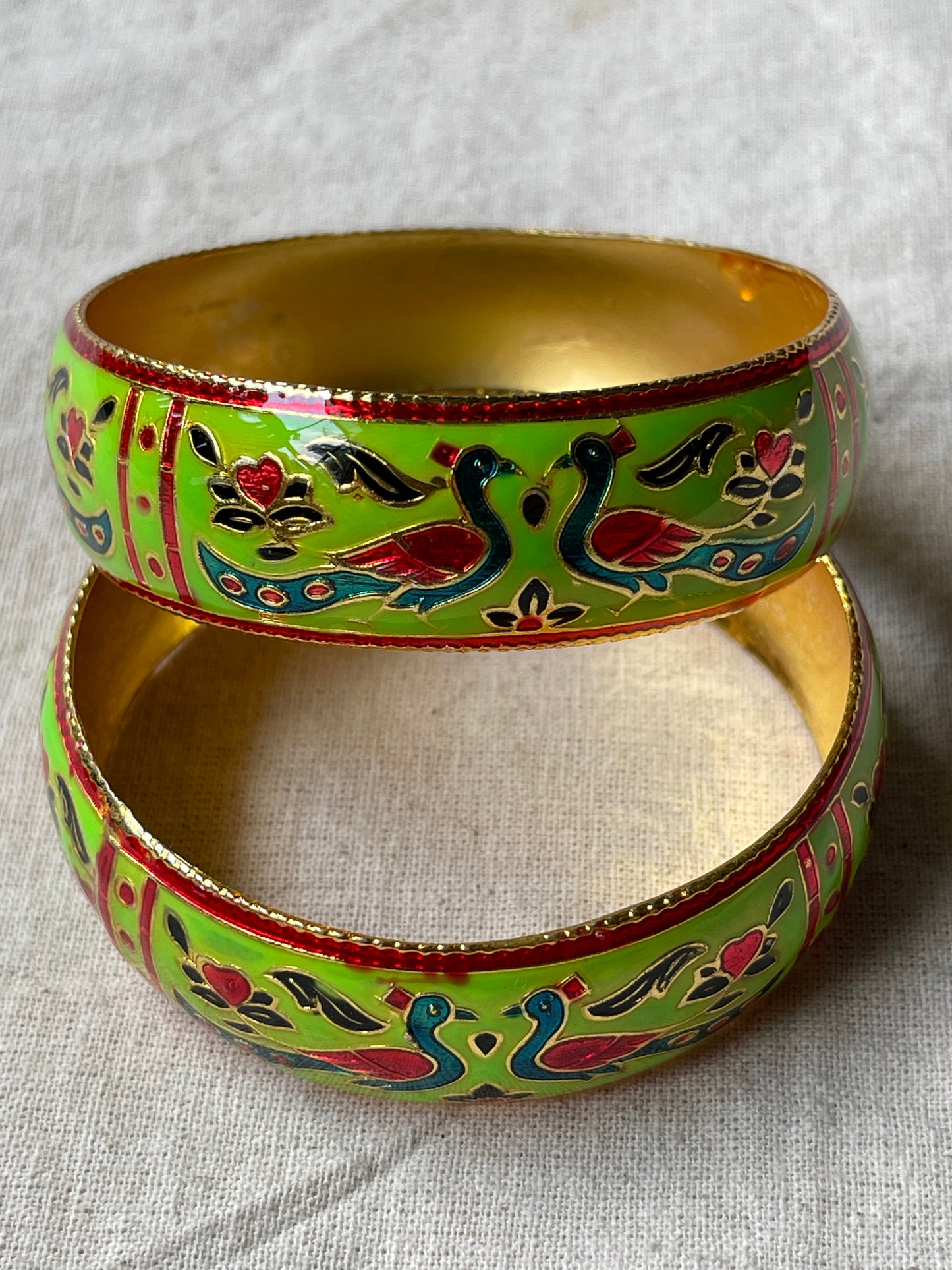 Lacquer enamel bangles pair with peacock motifs