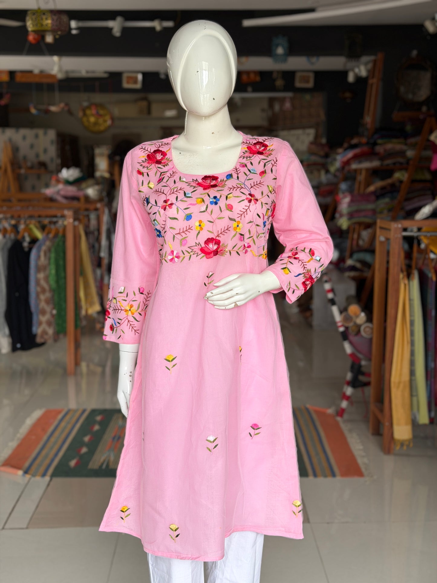 Pink hand embroidered floral design a-line net kurti