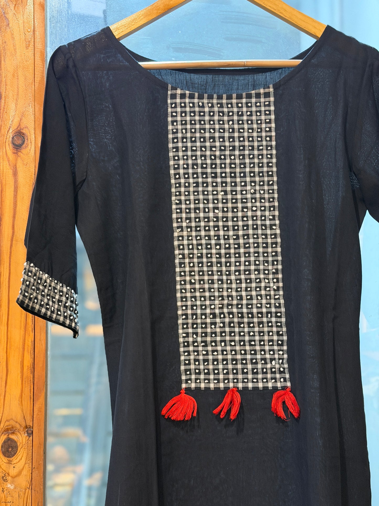 Black cotton straight kurti with white French knot embroidery on the front