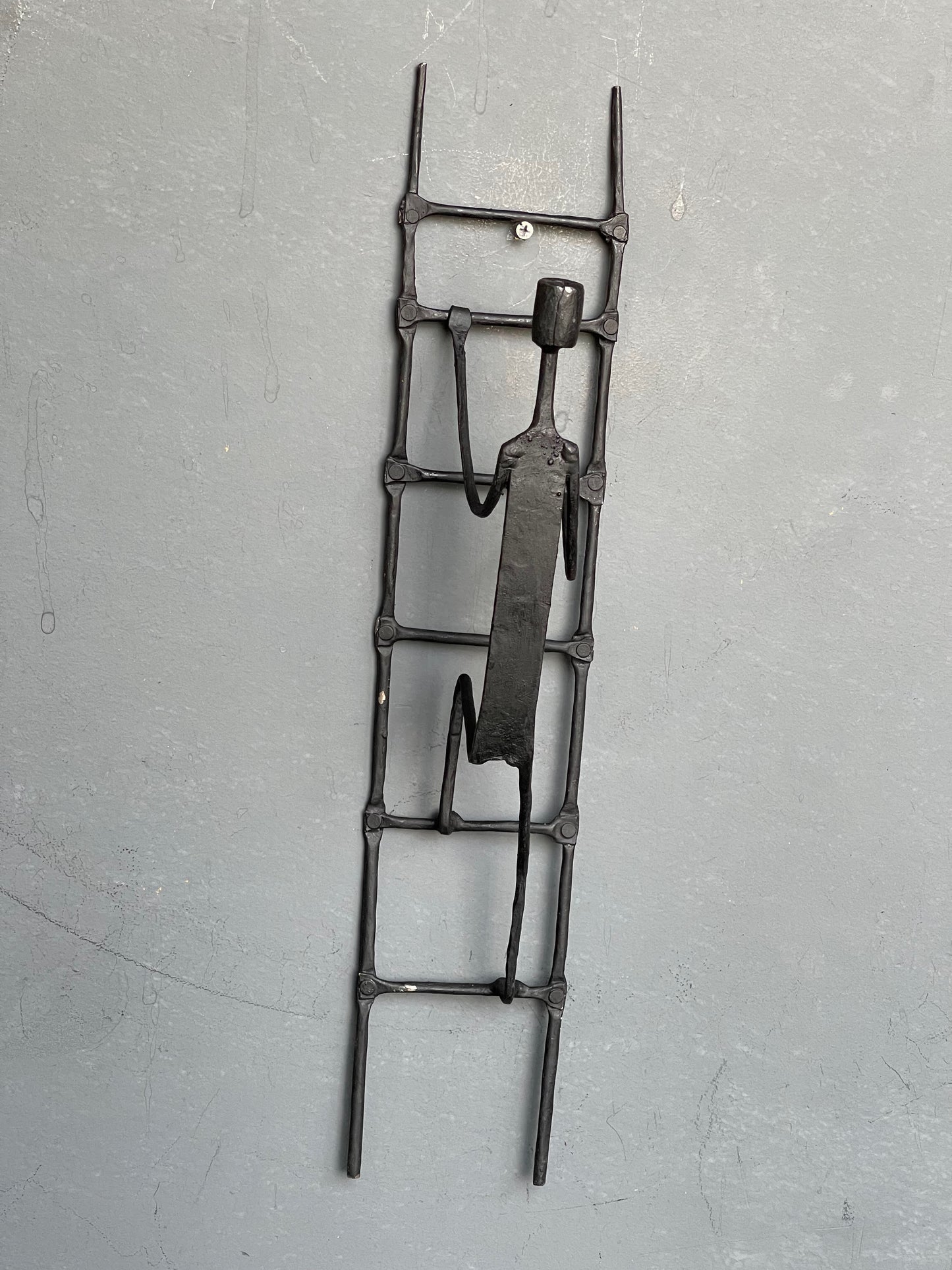 Person climbing ladder - handcrafted wrought iron