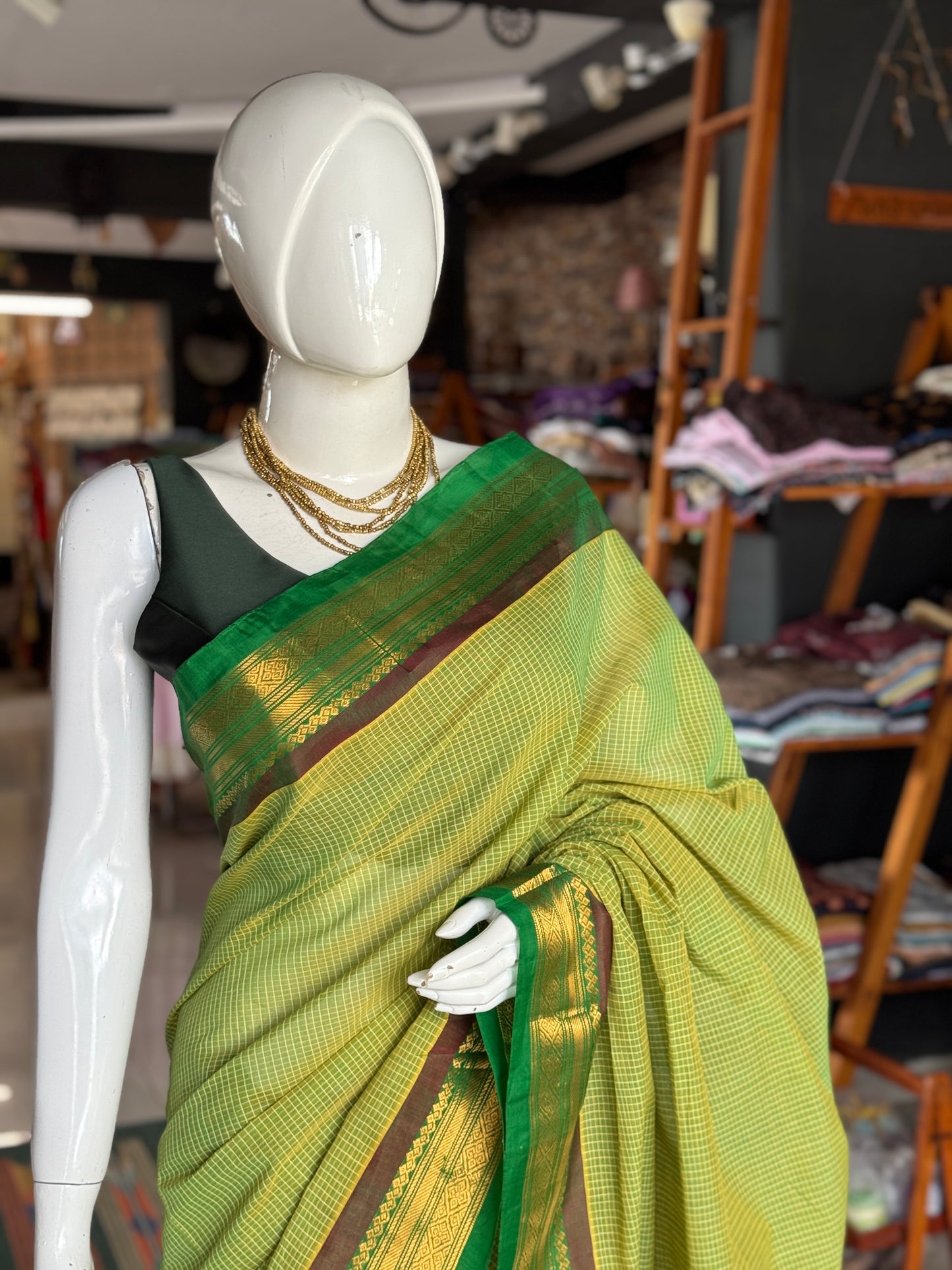 Gadwal cottons - green handwoven Gadwal cotton saree with silk Pallu and borders