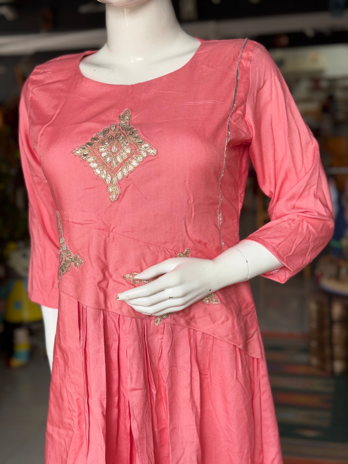 Peach soft rayon designer dress with low pleats and gota detailing