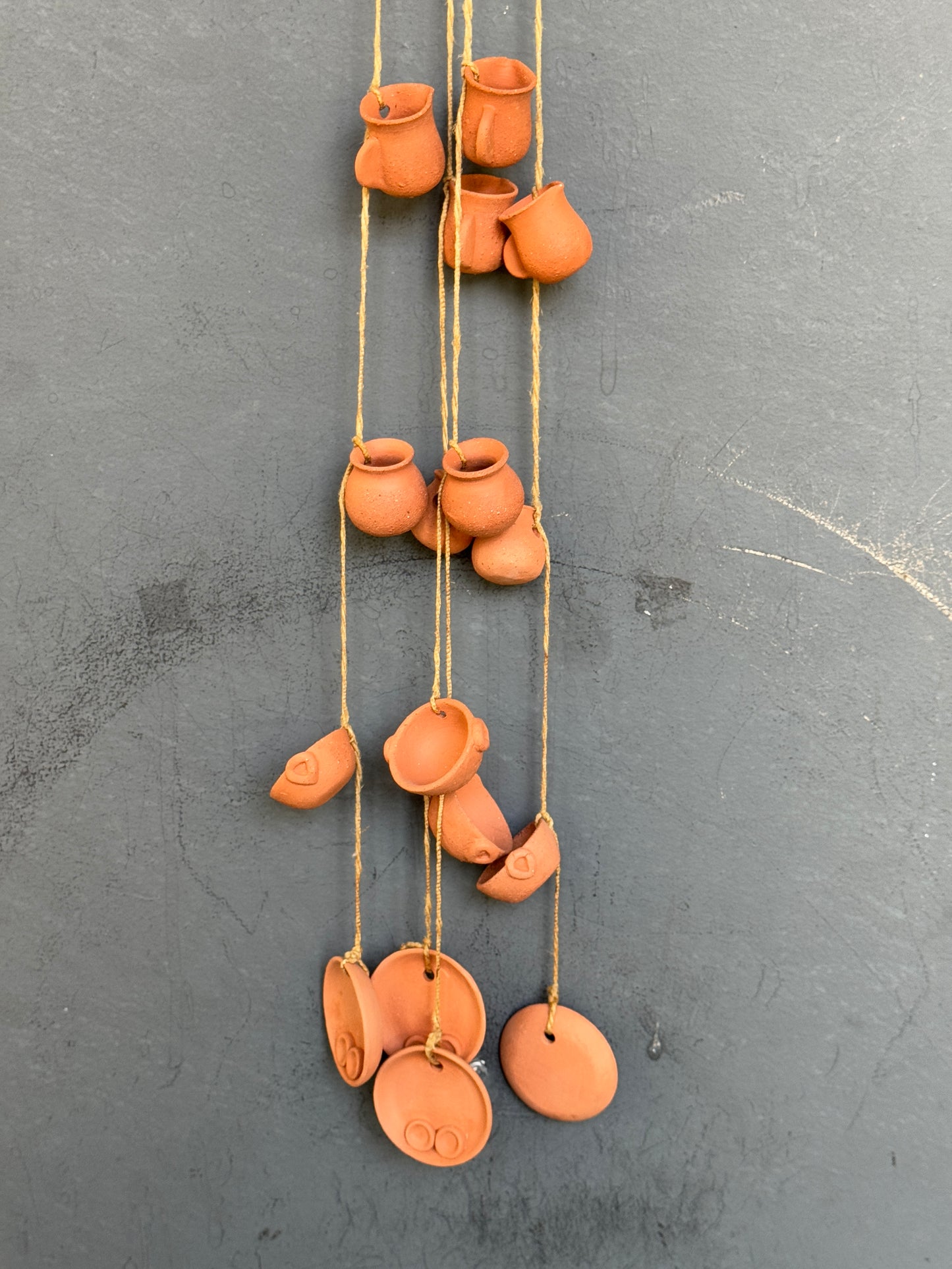 Clay hanging with 6 miniature handcrafted clay pots hung together with a thread