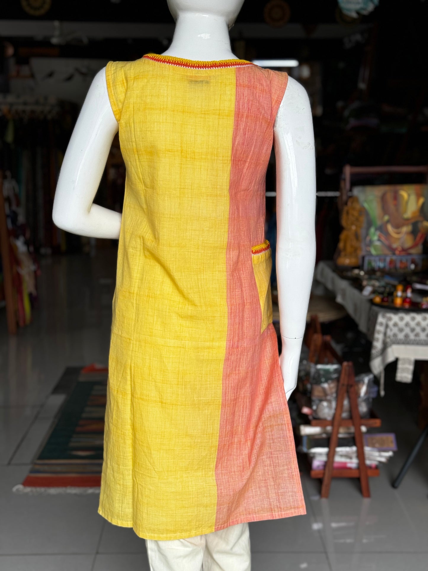 Peach yellow color block hand crocheted pocket details sleeveless cotton kurta