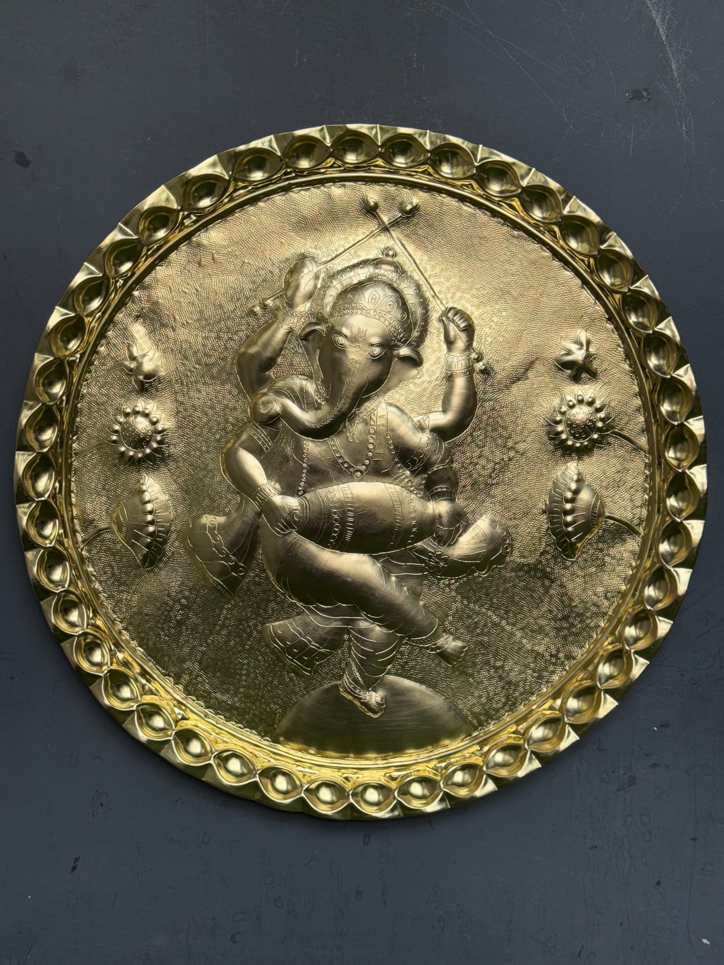 Ganesha in dancing pose - Brass handcrafted round wall plate - traditional embossed Chamba thaal