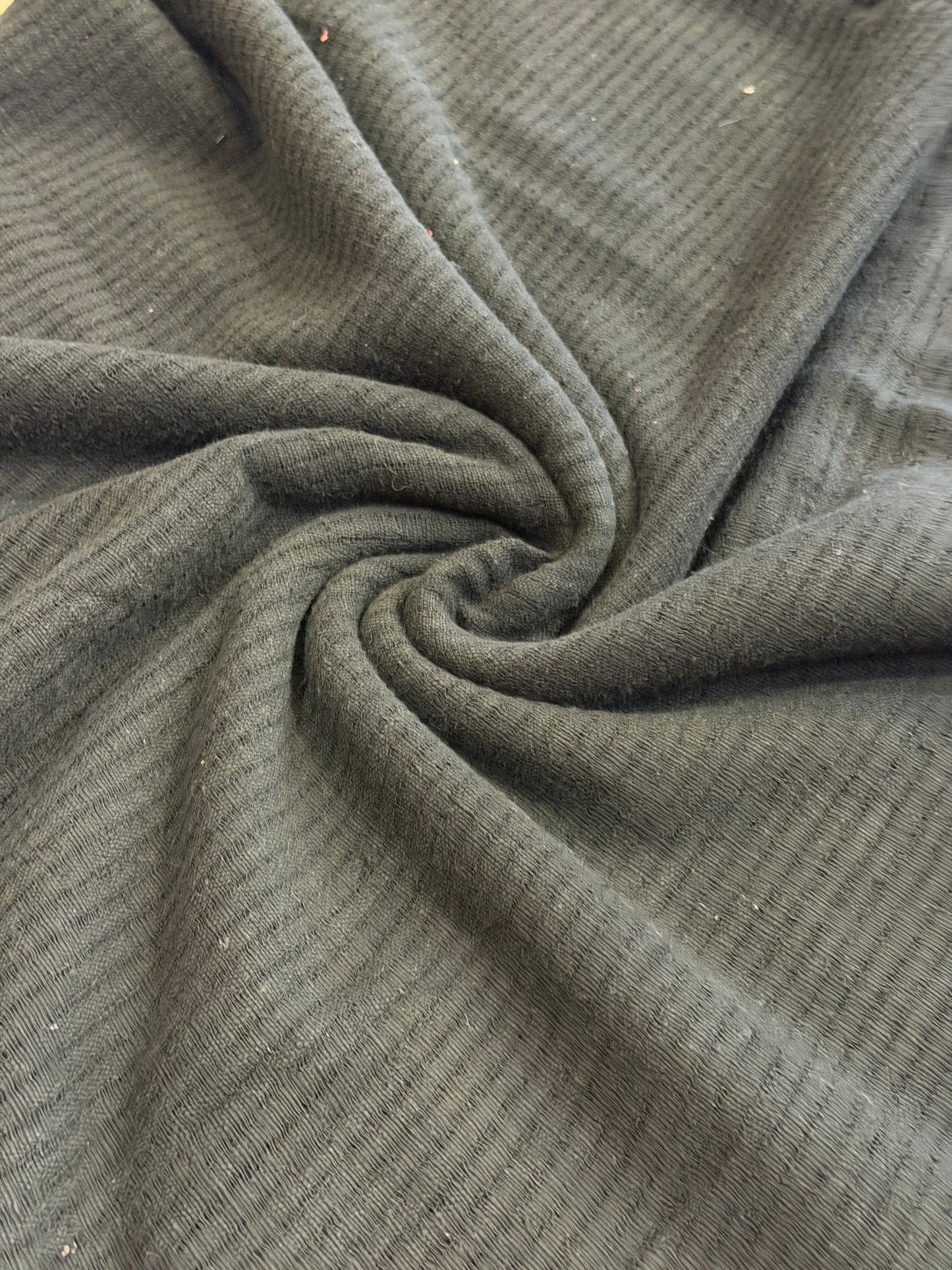 Black cotton hand spun, hand woven fabric with missing thread stripes weave
