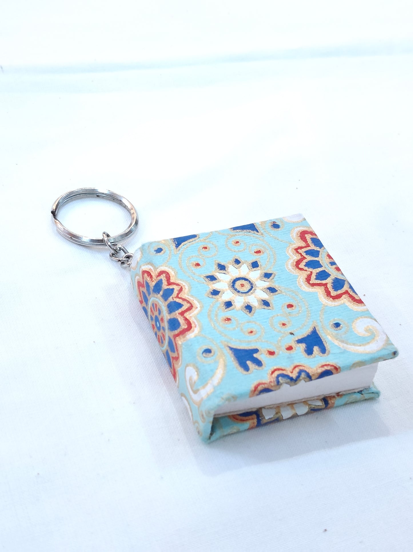 Key ring with small hand made paper notebook