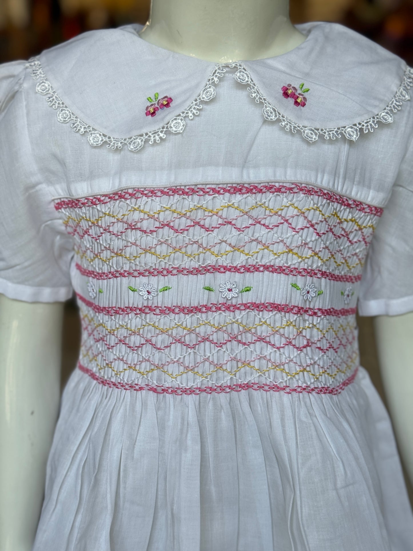 White hand embroidered smocking cotton frock for girls with collar and frills at hem