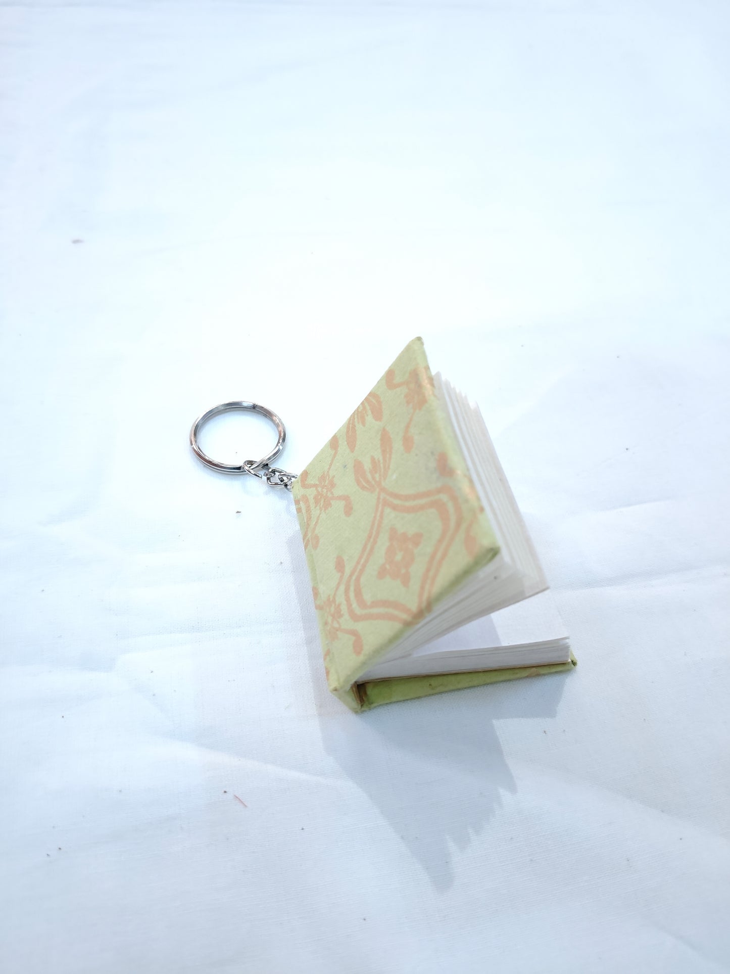 Key ring with small hand made paper notebook