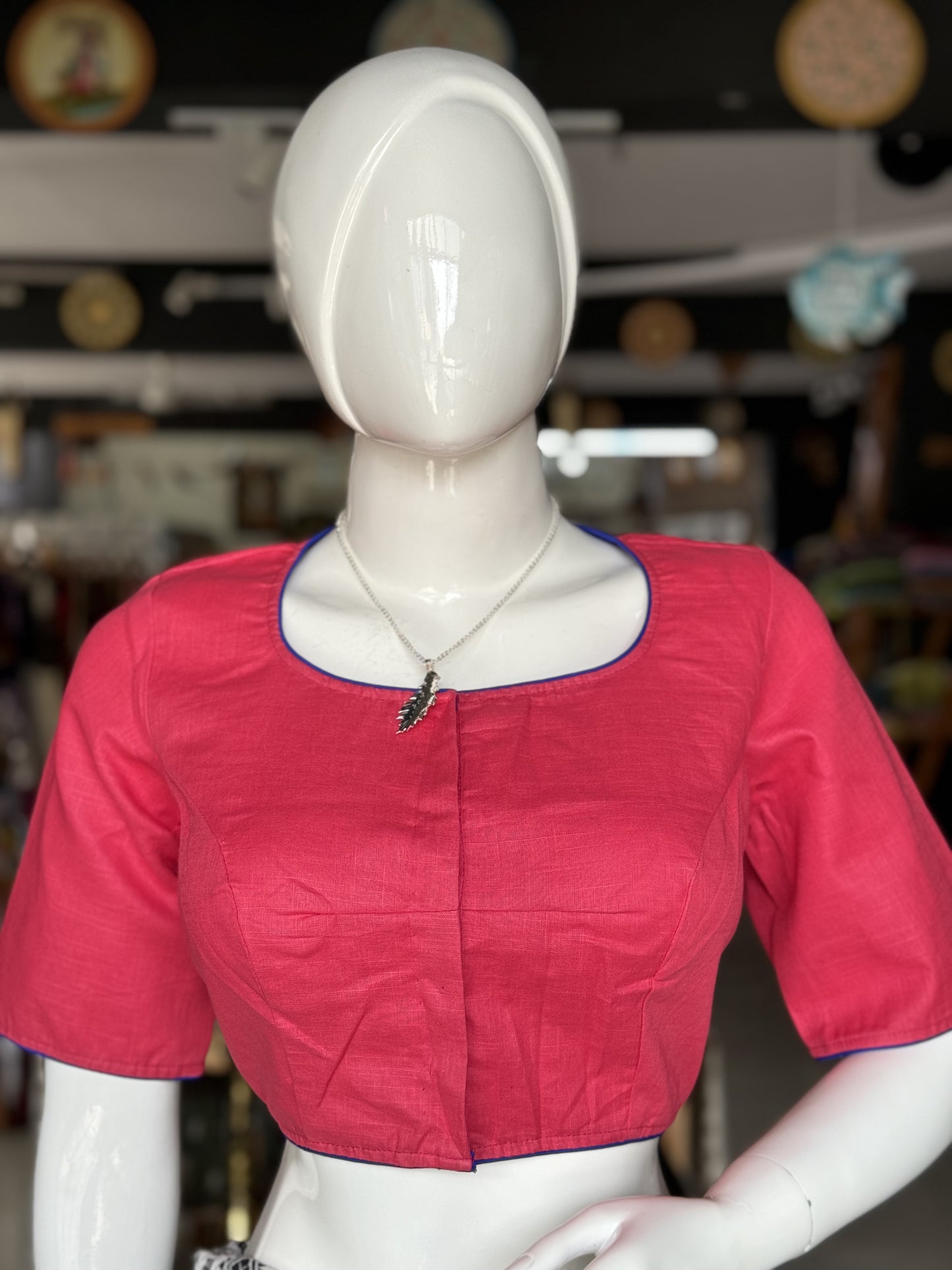 Pink cotton blouse with inverted umbrella embroidery at the back