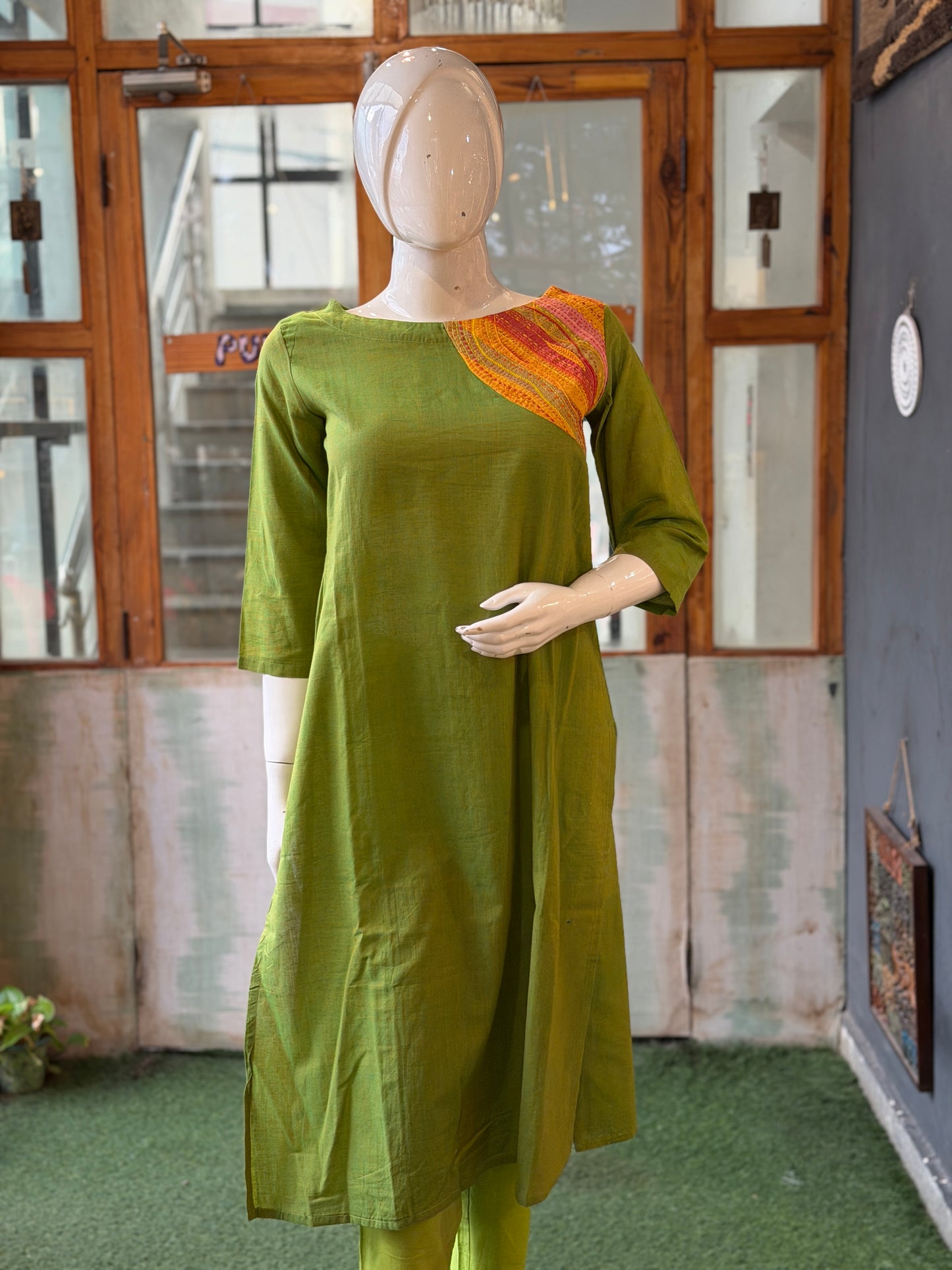 Green cotton kurti with colorful hand embroidered shoulder