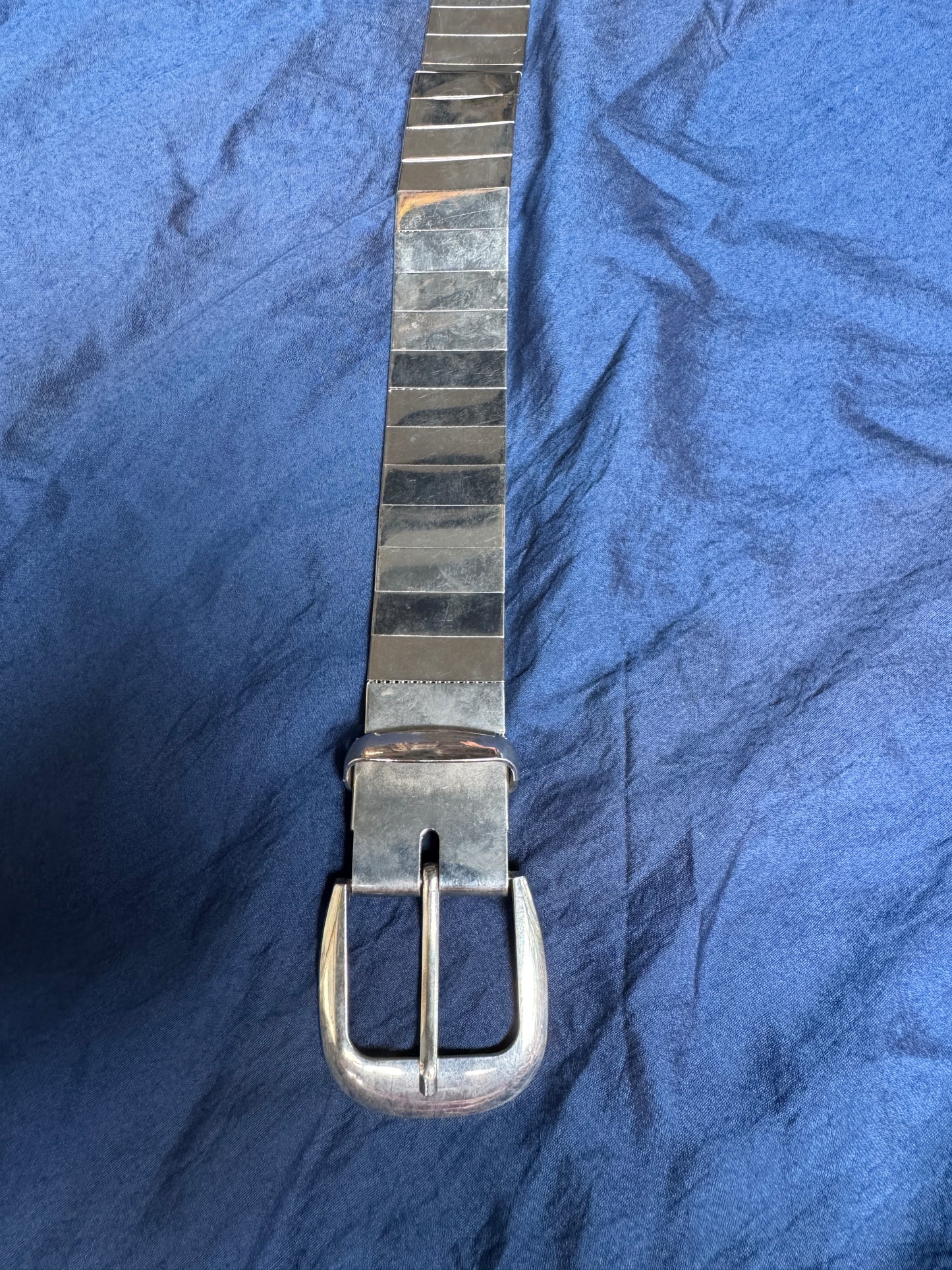 Steel look belt with buckle