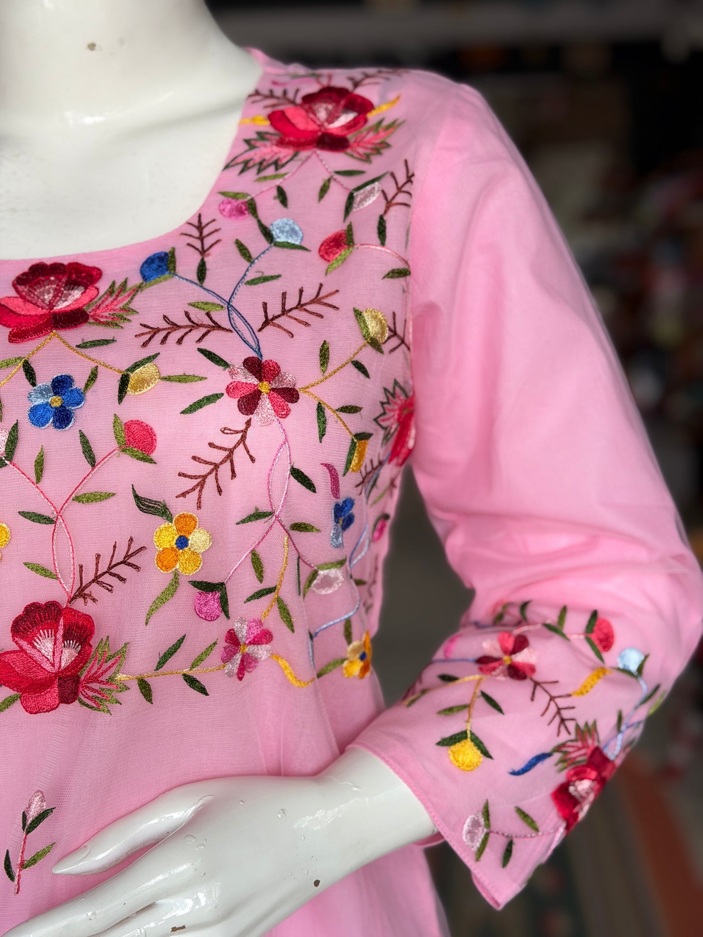 Pink hand embroidered floral design a-line net kurti