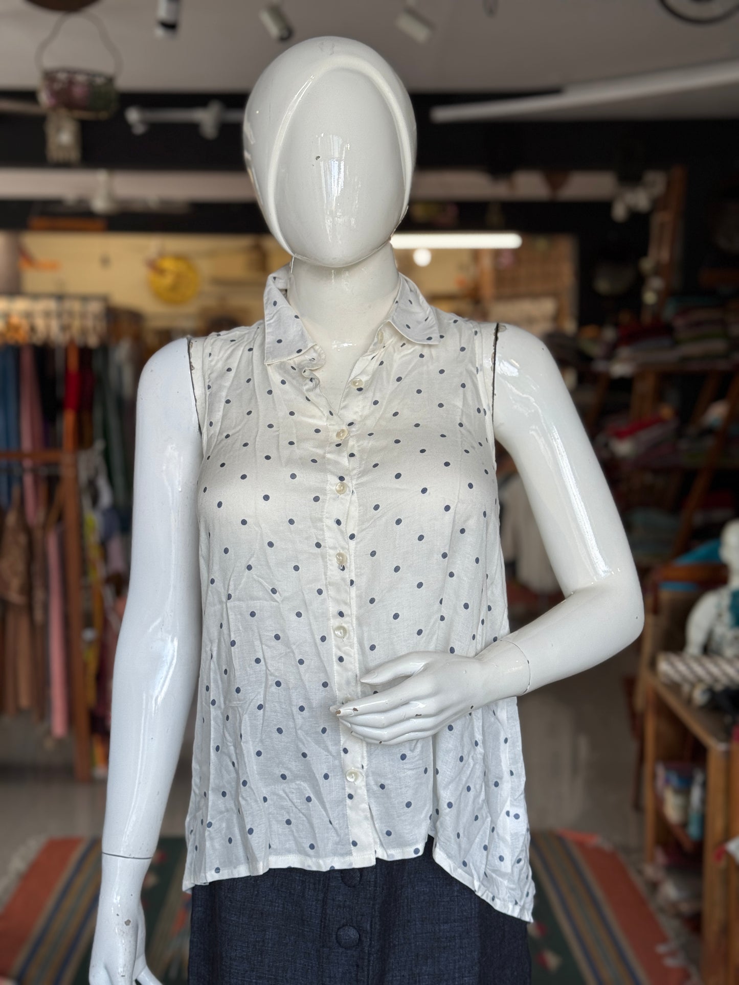 Polka dot prints on white sleeveless top for women