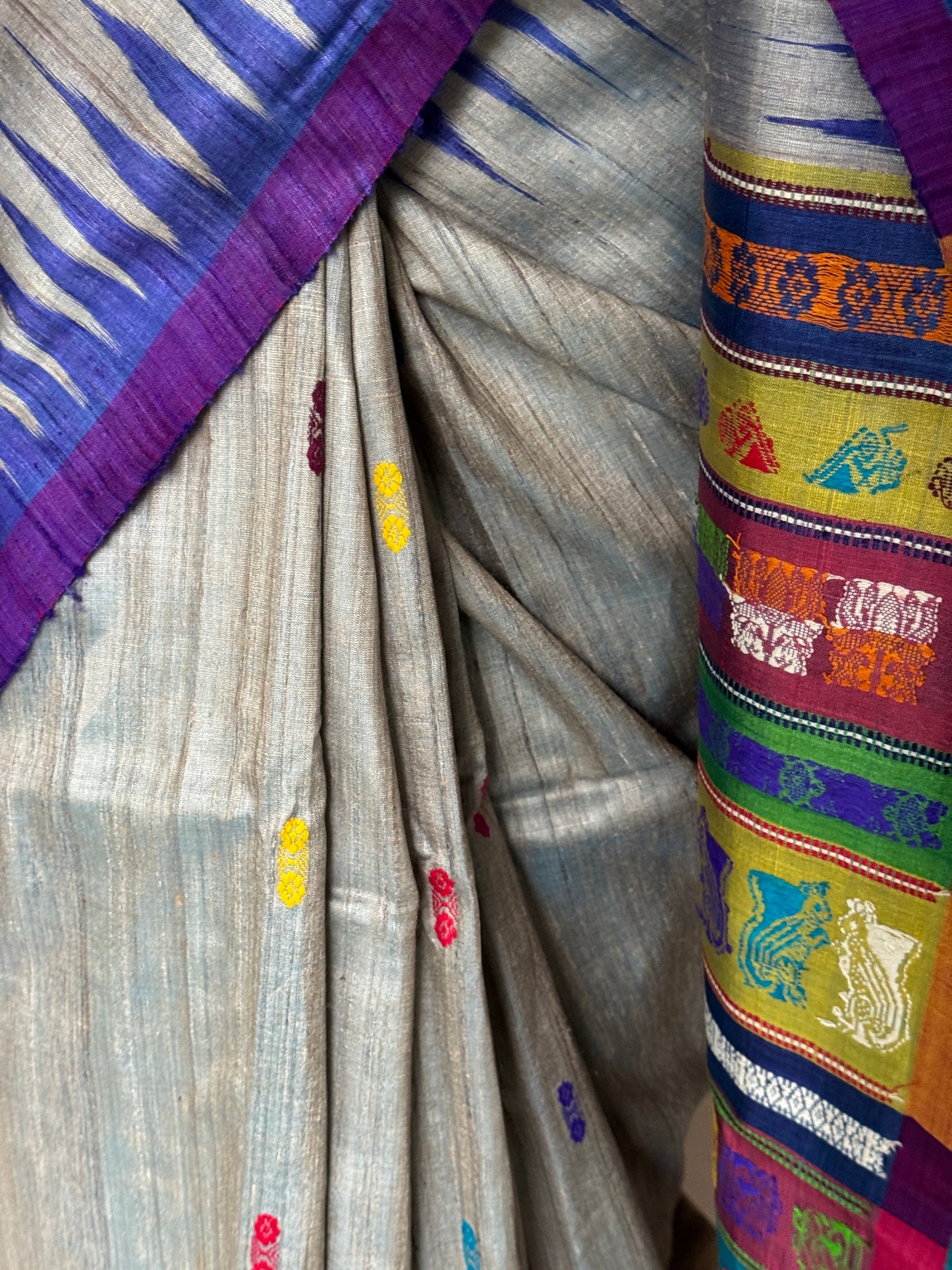 Silver blue tone pure tussar silk handwoven saree with extra weft flower butis and colorful jala palla